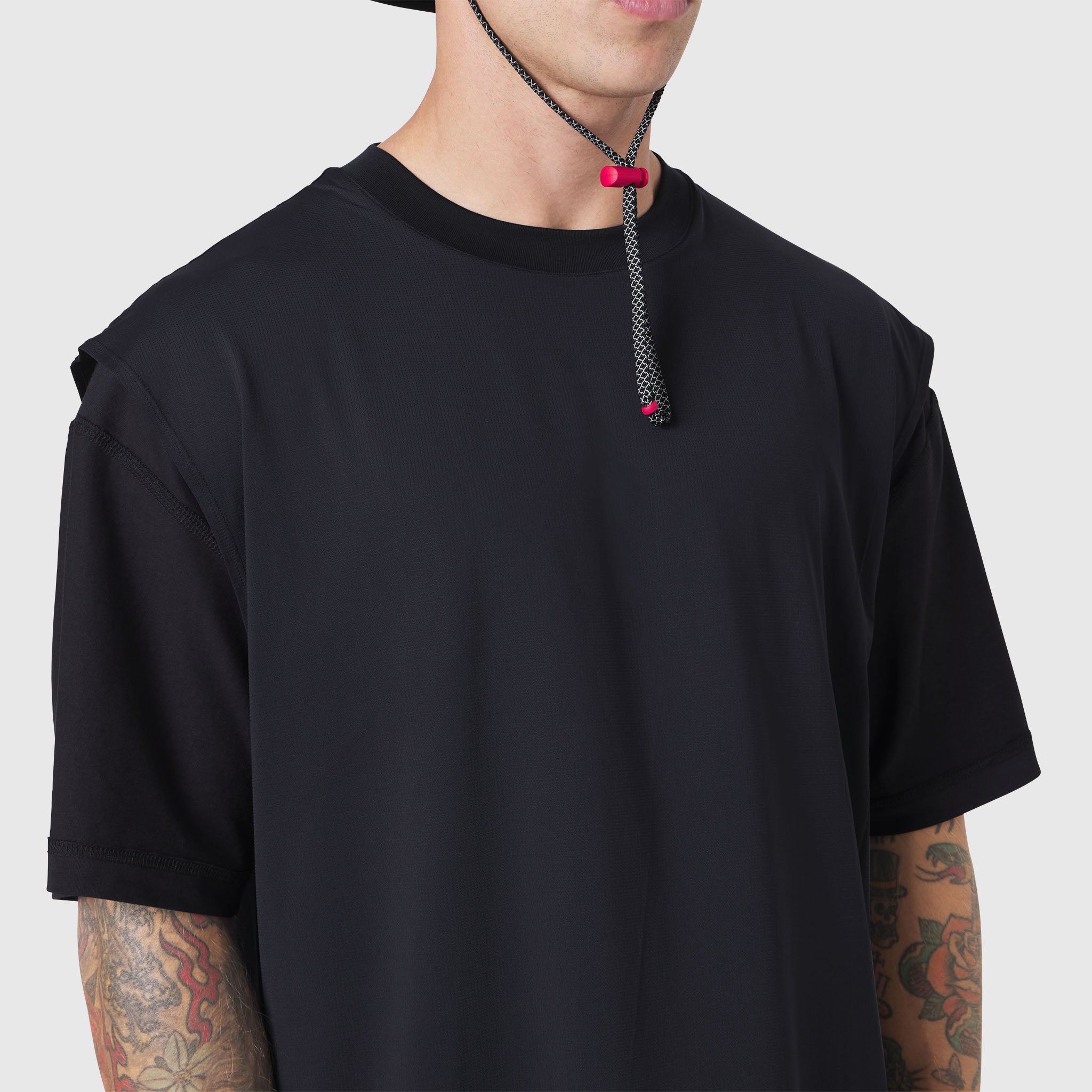 Black Supima Ice-Skin reversible tee worn by model with tattoos, front view