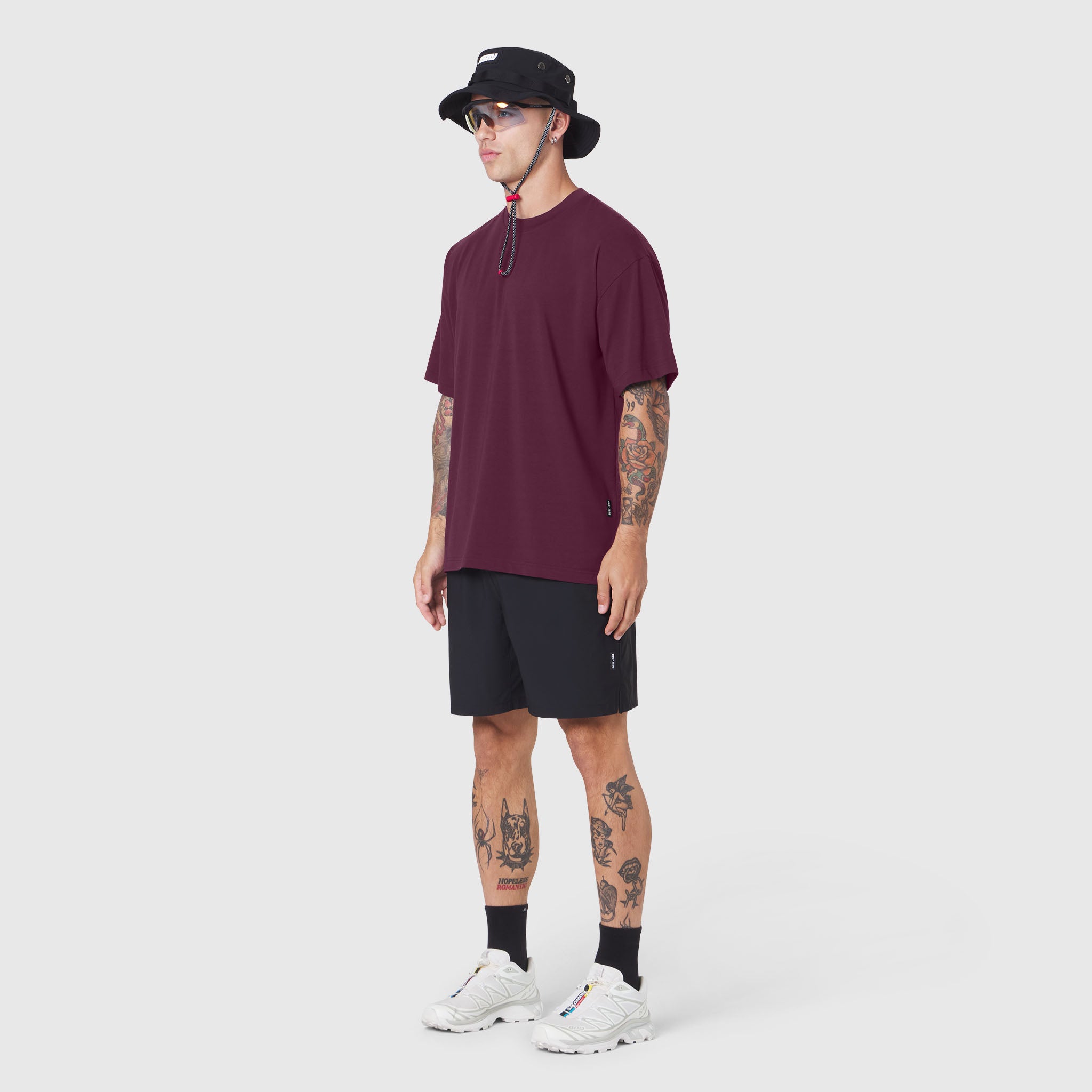 Supima Ice-Skin Reversible Tee in merlot worn by model with black shorts and white sneakers