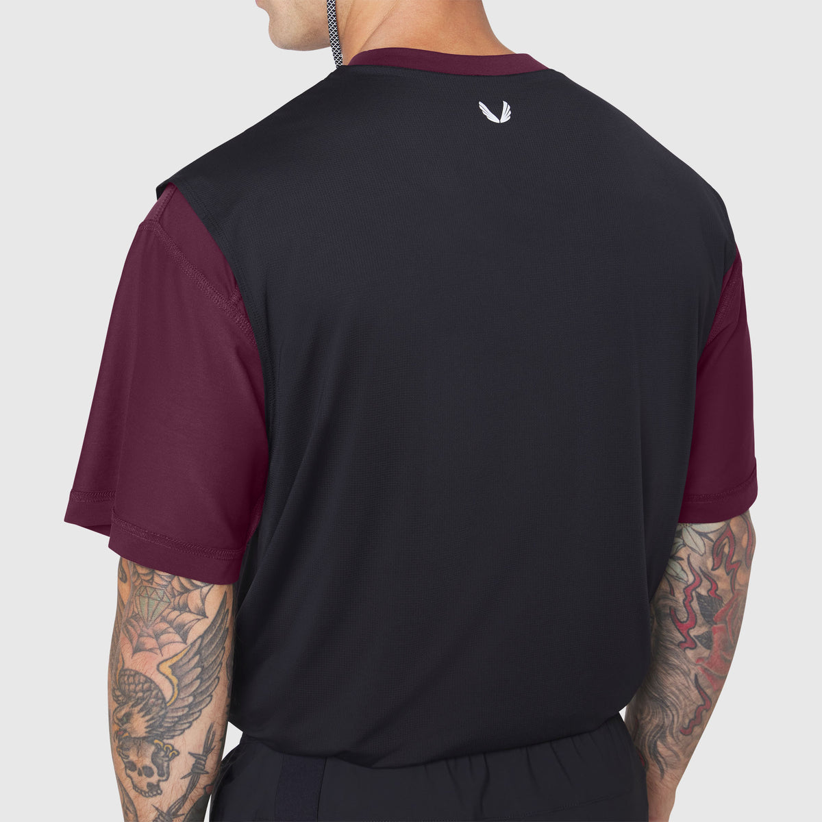 Supima Ice-Skin Reversible Tee in merlot and black, worn by model shown from back