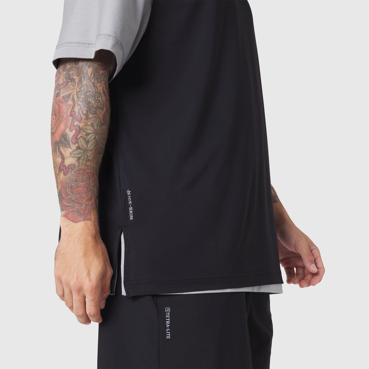 Supima Ice-Skin Reversible Tee in slate grey and black, worn by model showing side view