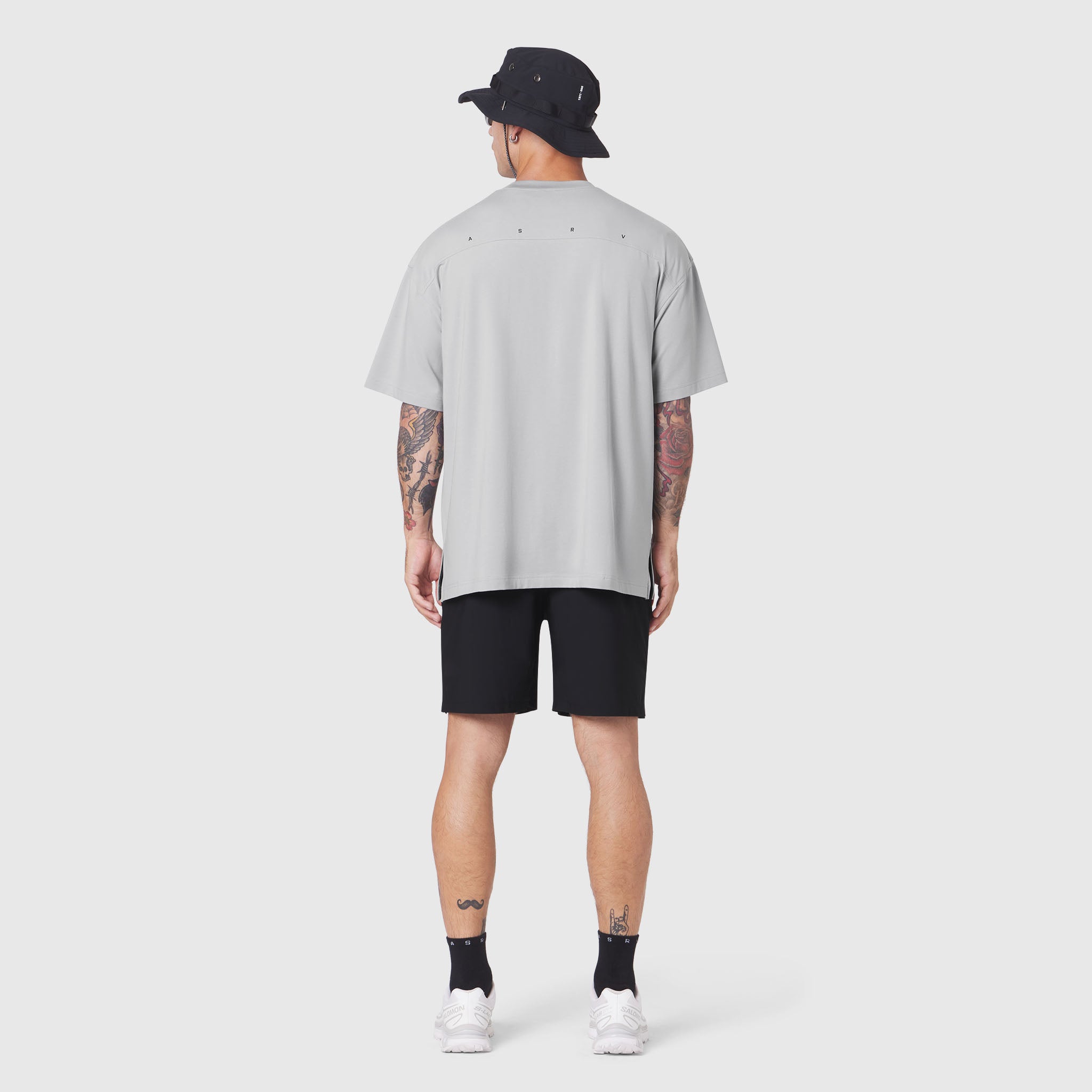 Supima Ice-Skin Reversible Tee in slate grey worn by model from back, paired with black shorts