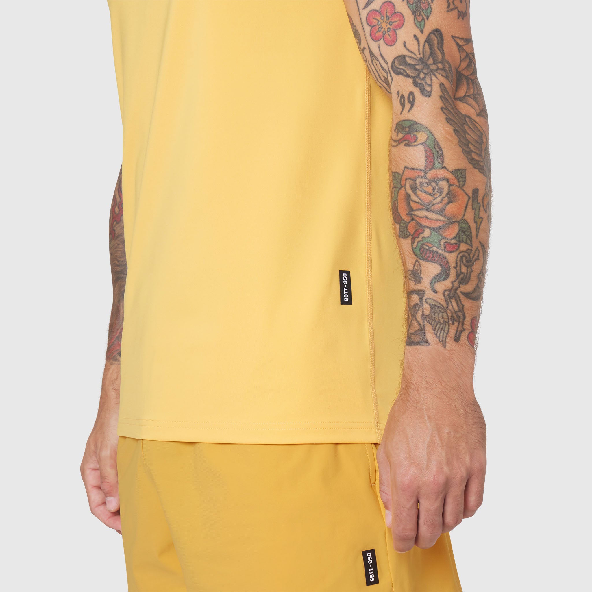 Warpflexx-Lite Training Tank in amber yellow worn by model, side view