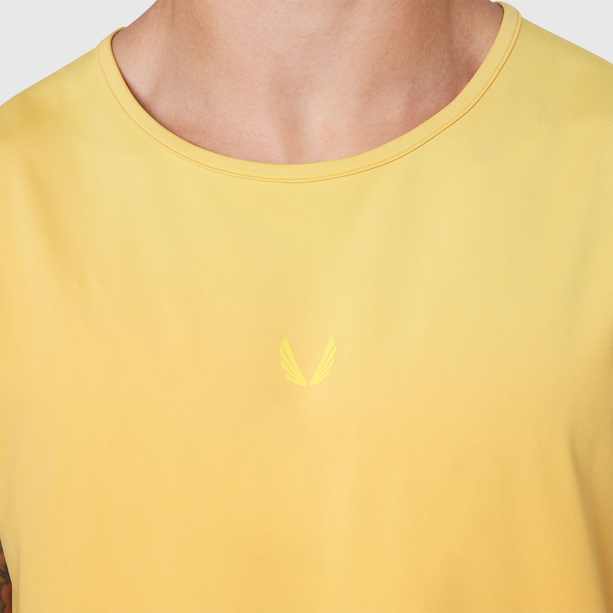 Warpflexx-Lite Training Tank in amber yellow worn by model, front view