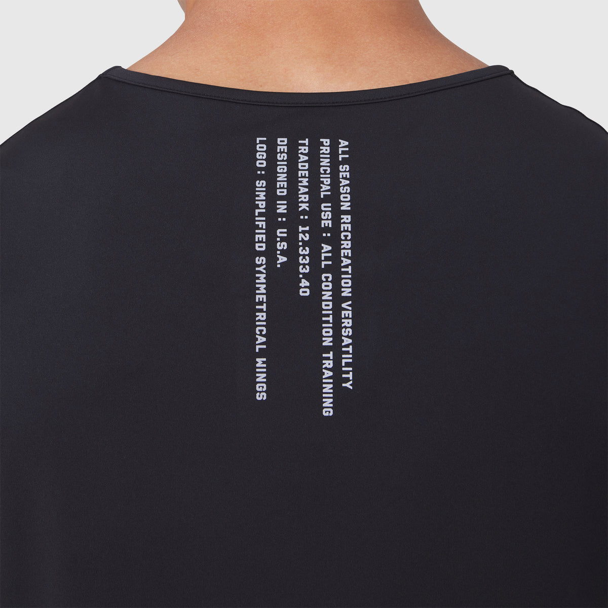 Warpflexx-Lite Training Tank in black, back view with text graphic on model