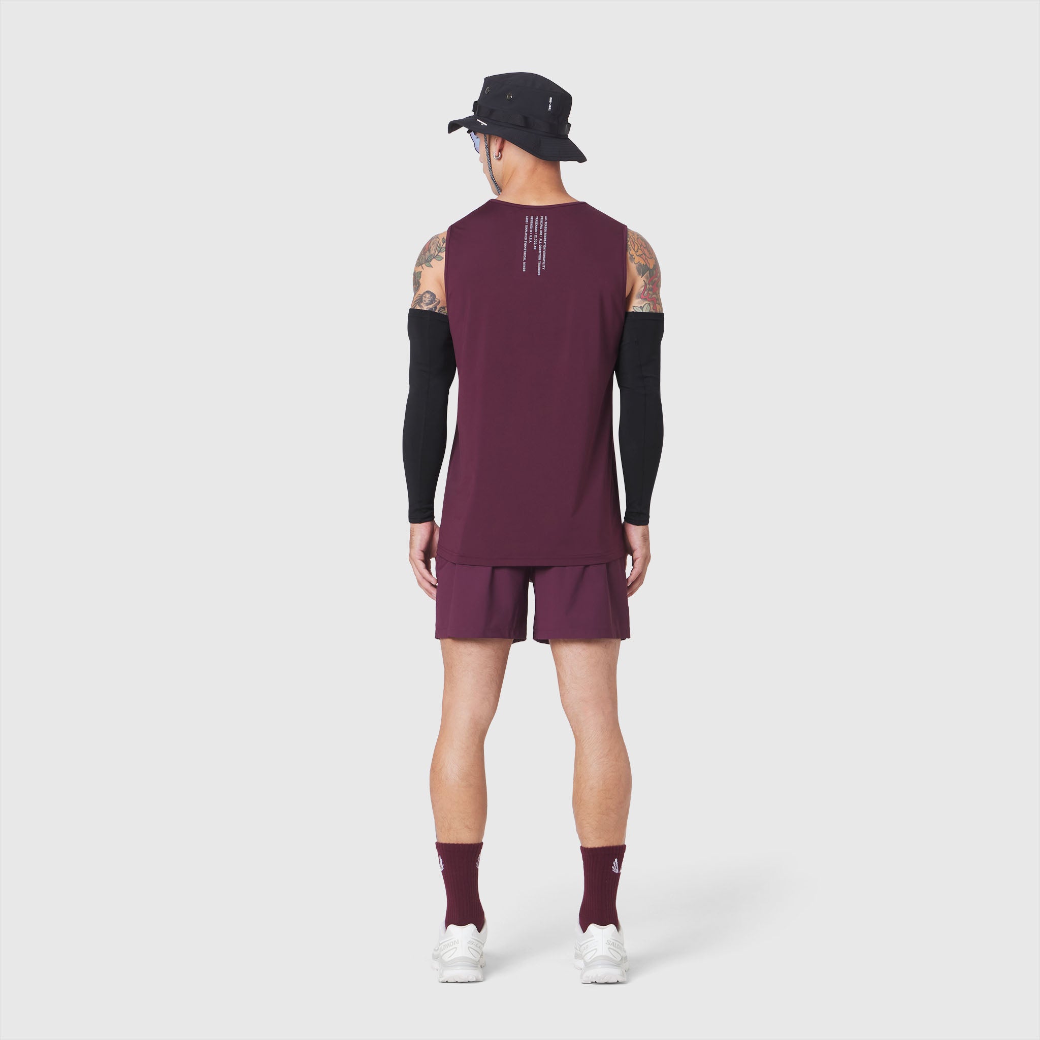 Warpflexx-Lite Training Tank in merlot with black sleeves, back view on model
