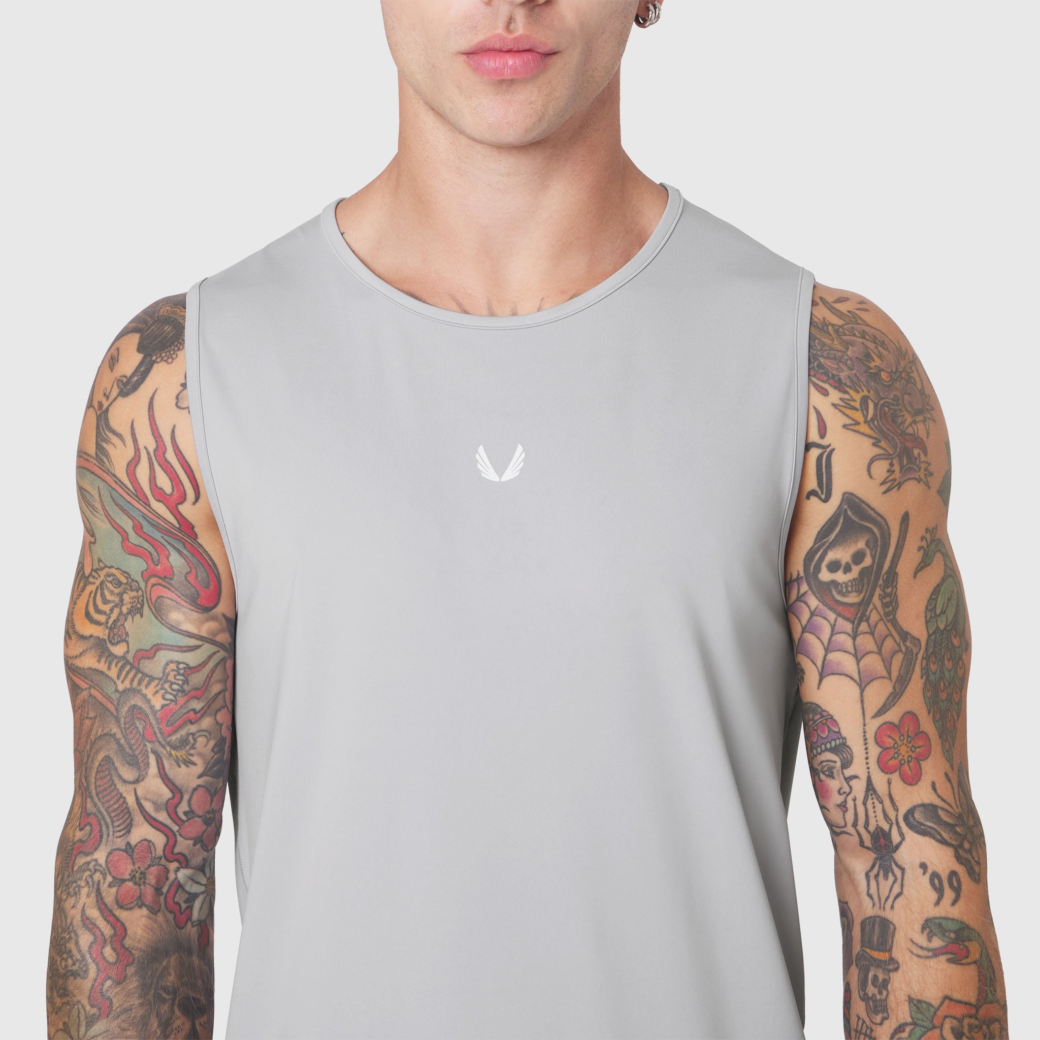 Warpflexx-Lite® Training Tank in slate grey worn by tattooed model, front view