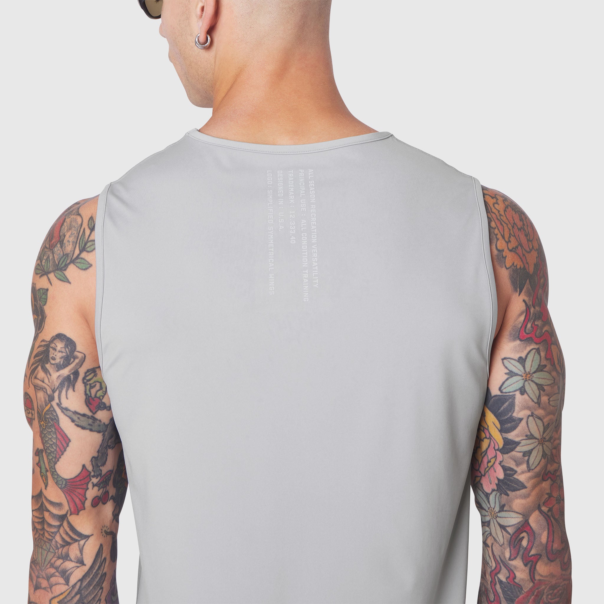 Warpflexx-Lite® Training Tank in slate grey, back view on model with tattoos