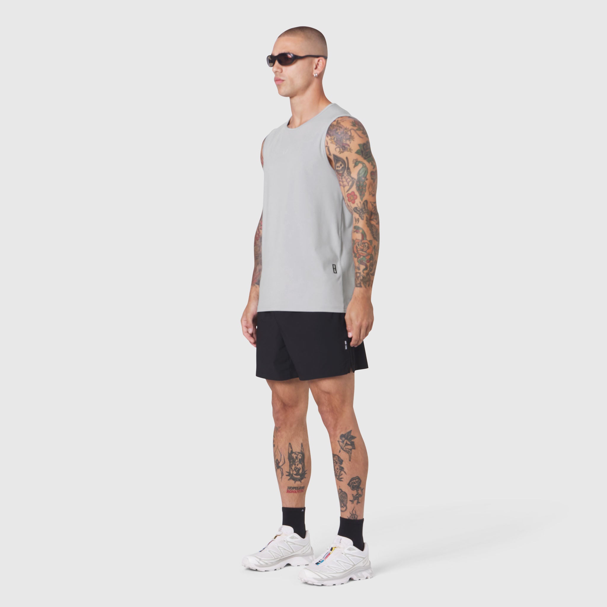 Warpflexx-Lite Training Tank in slate grey worn with black shorts, side view