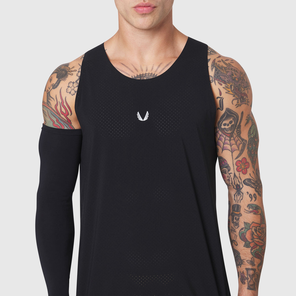 Black Aerotex Perforated Run Tank worn by tattooed male model, front view