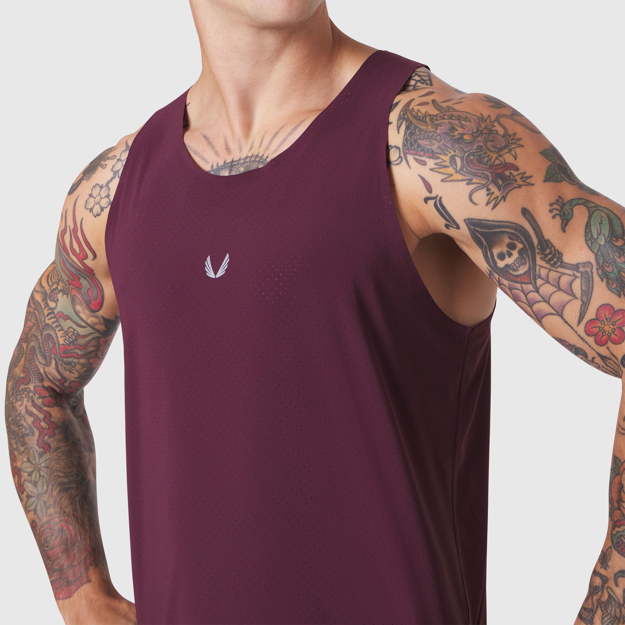Aerotex™ Perforated Run Tank in merlot, worn by tattooed model, front view
