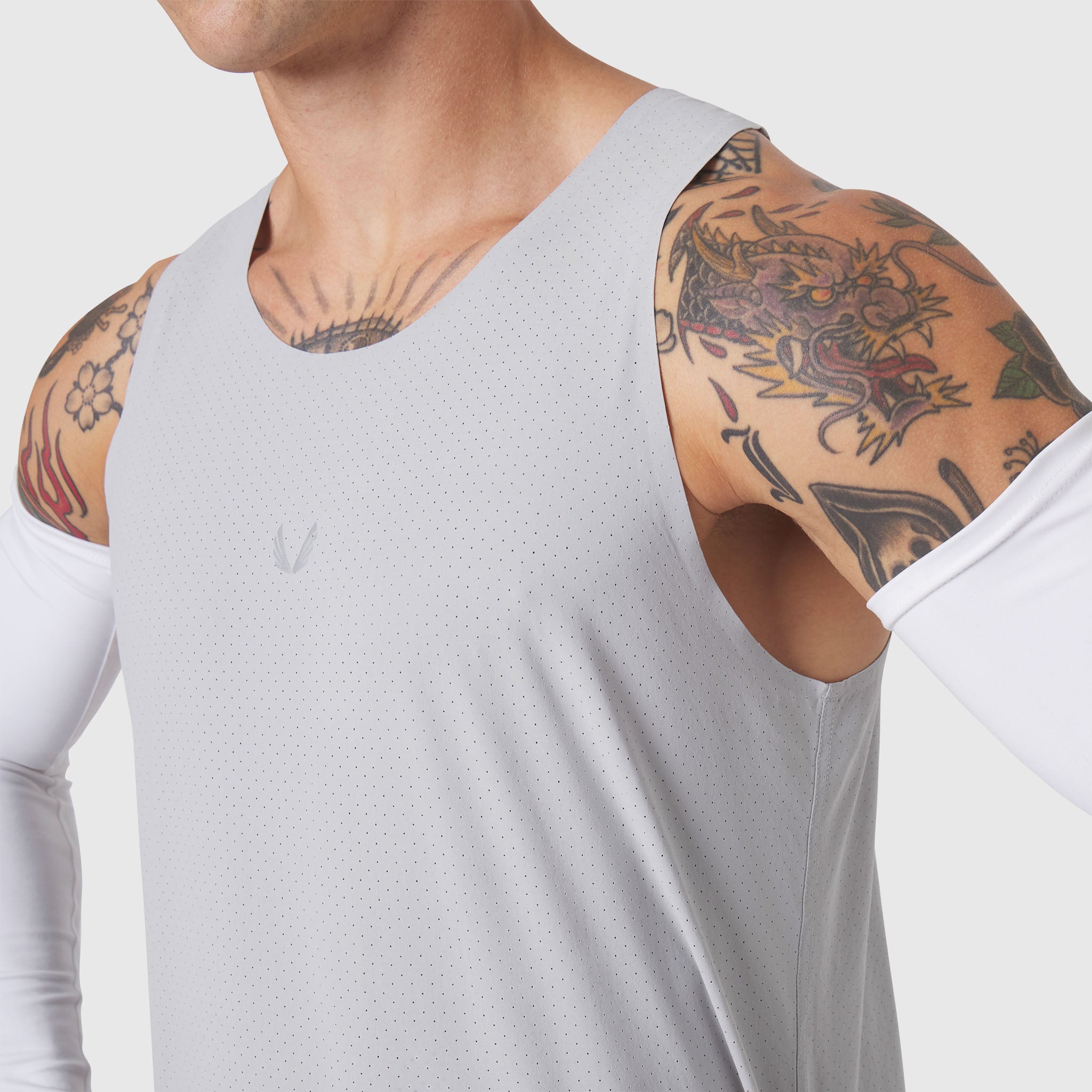 Aerotex Perforated Run Tank in slate grey, worn by model showing front view