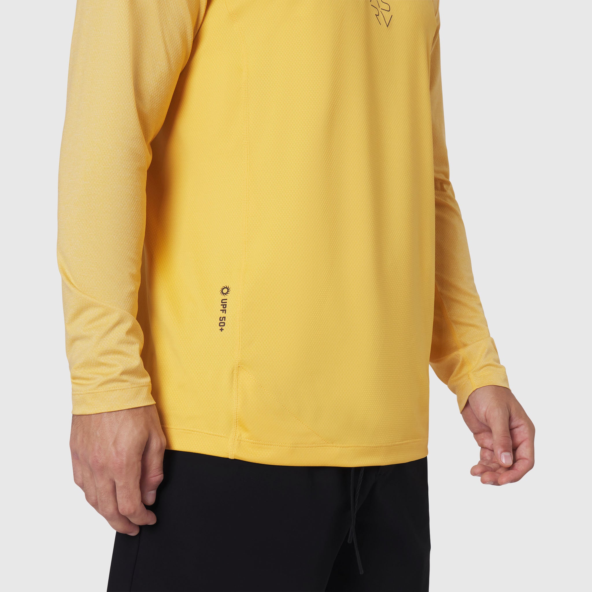 AEROSILVER UPF50+ Run Long Sleeve in amber, worn by model, side view