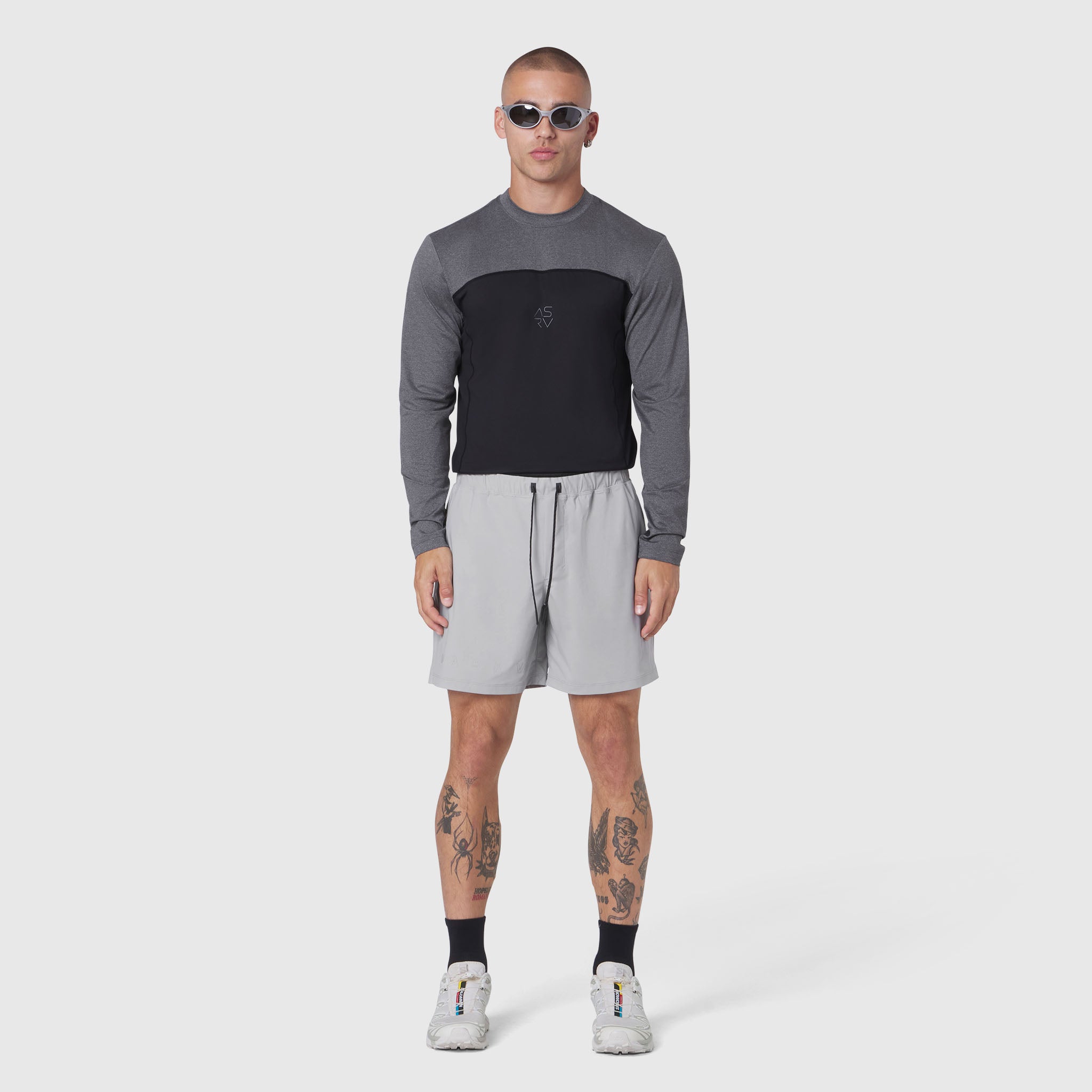 AEROSILVER® UPF50+ Run Long Sleeve in black and grey, modeled with light grey shorts, front view