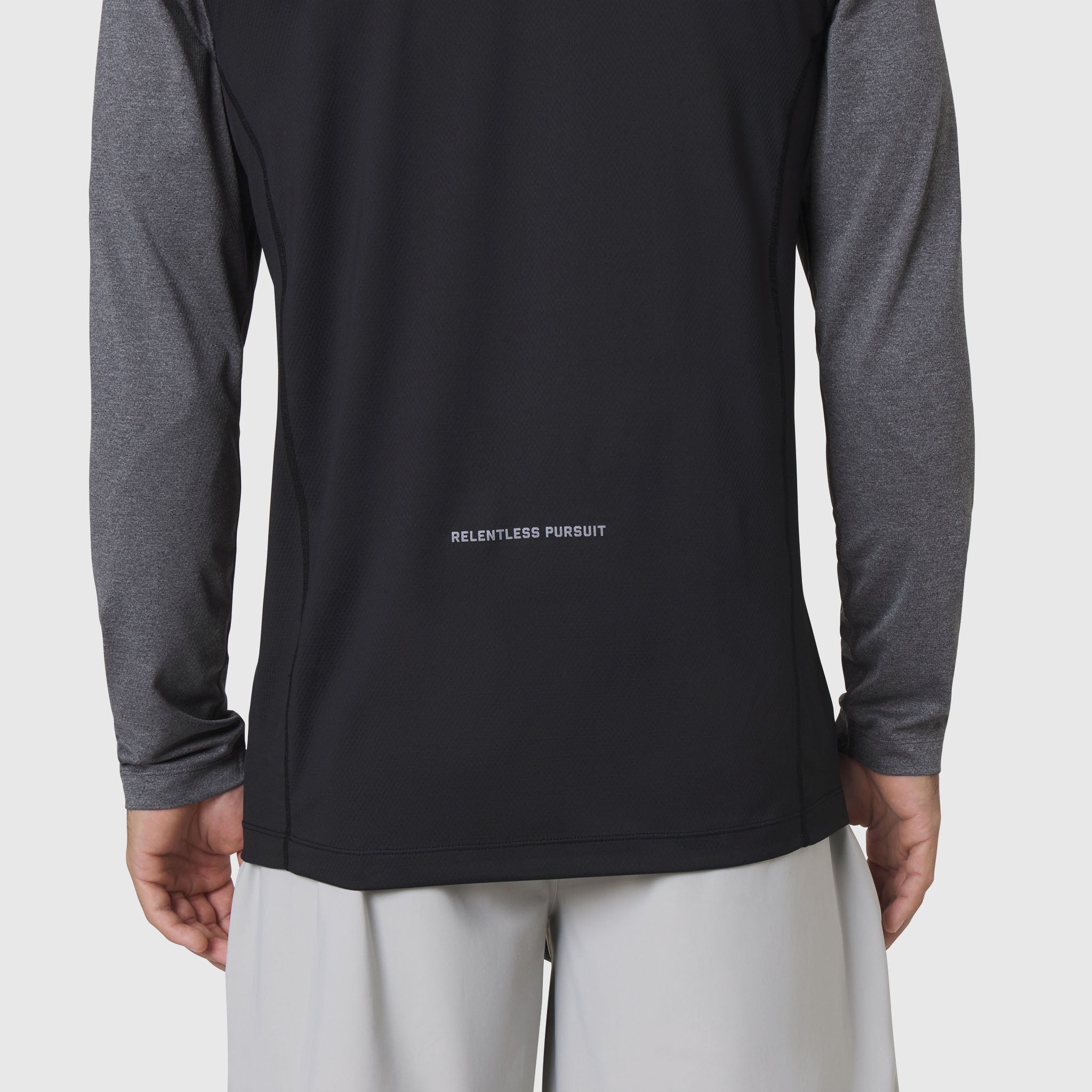 AEROSILVER® UPF50+ Run Long Sleeve in black with gray sleeves, back view on model