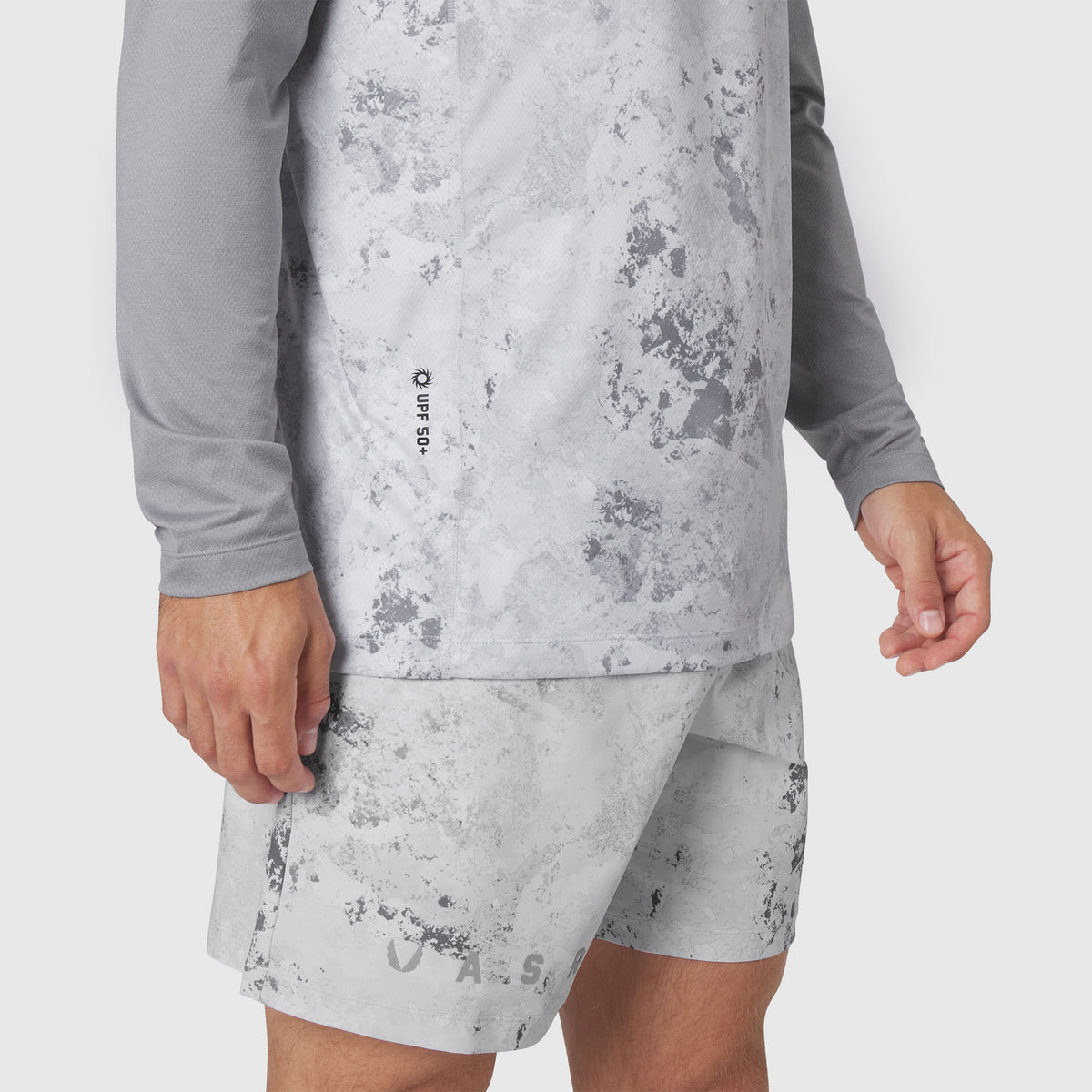 AEROSILVER® UPF50+ Run Long Sleeve in Sedona Snow Camo worn with matching shorts, side view