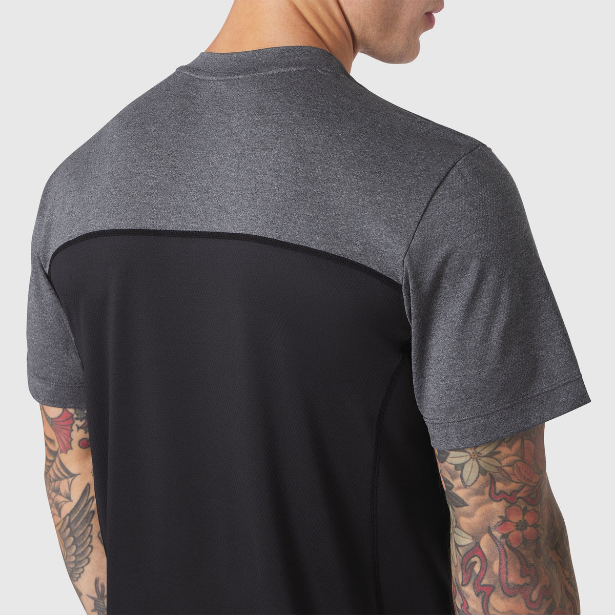 AEROSILVER® UPF50+ Run Tee in black and charcoal colorblock, back view on model