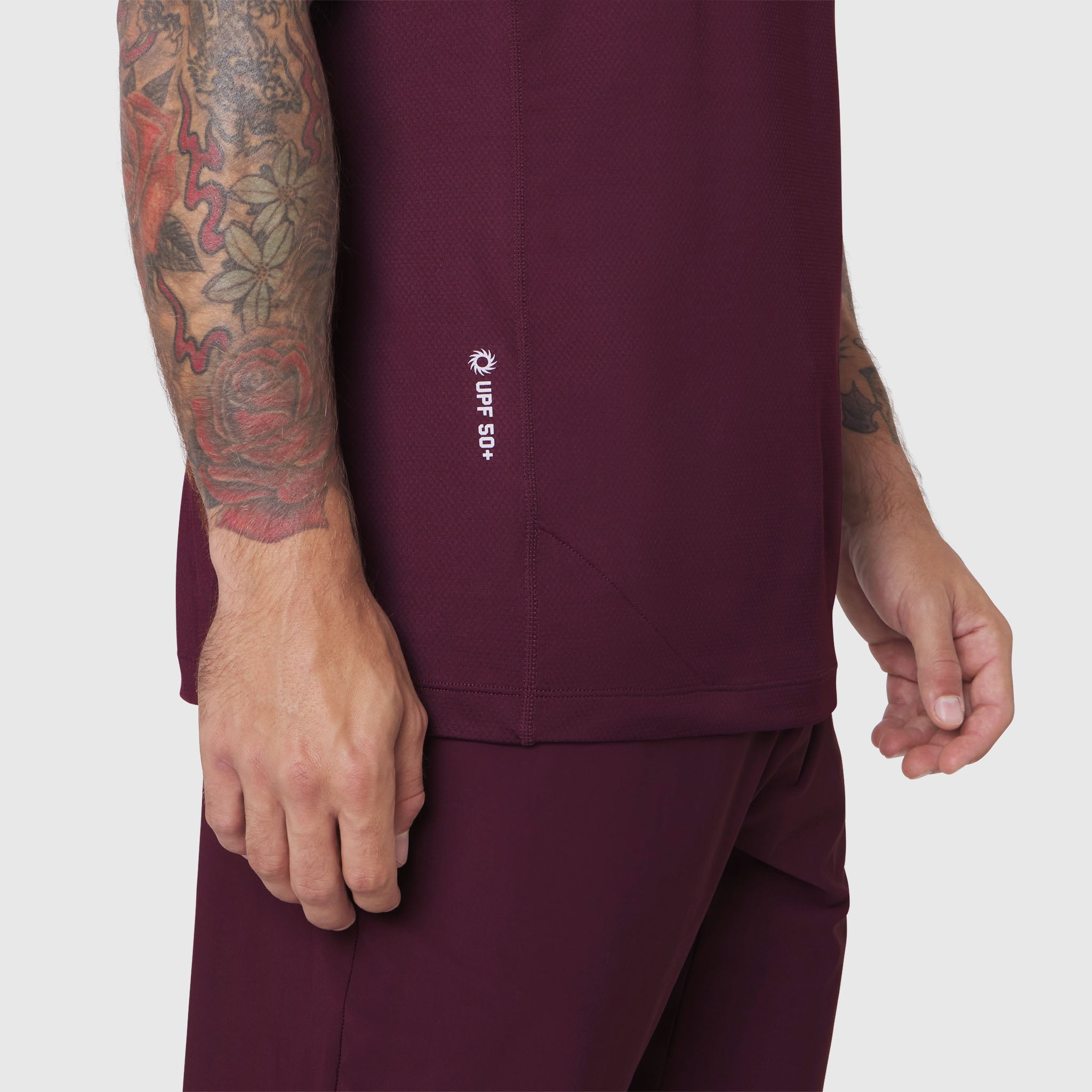 AEROSILVER® UPF50+ Run Tee in merlot worn by model, side view detail