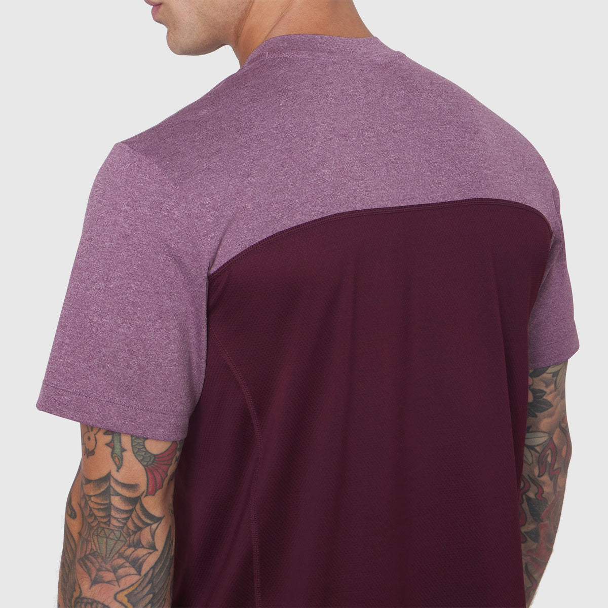 AEROSILVER® UPF50+ Run Tee in merlot and mauve colorblock, back view on model