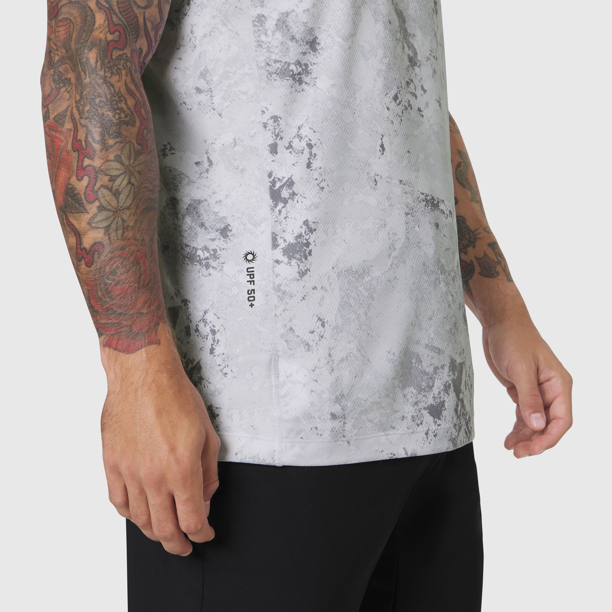 AEROSILVER® UPF50+ Run Tee in Sedona Snow Camo worn by tattooed model, side view