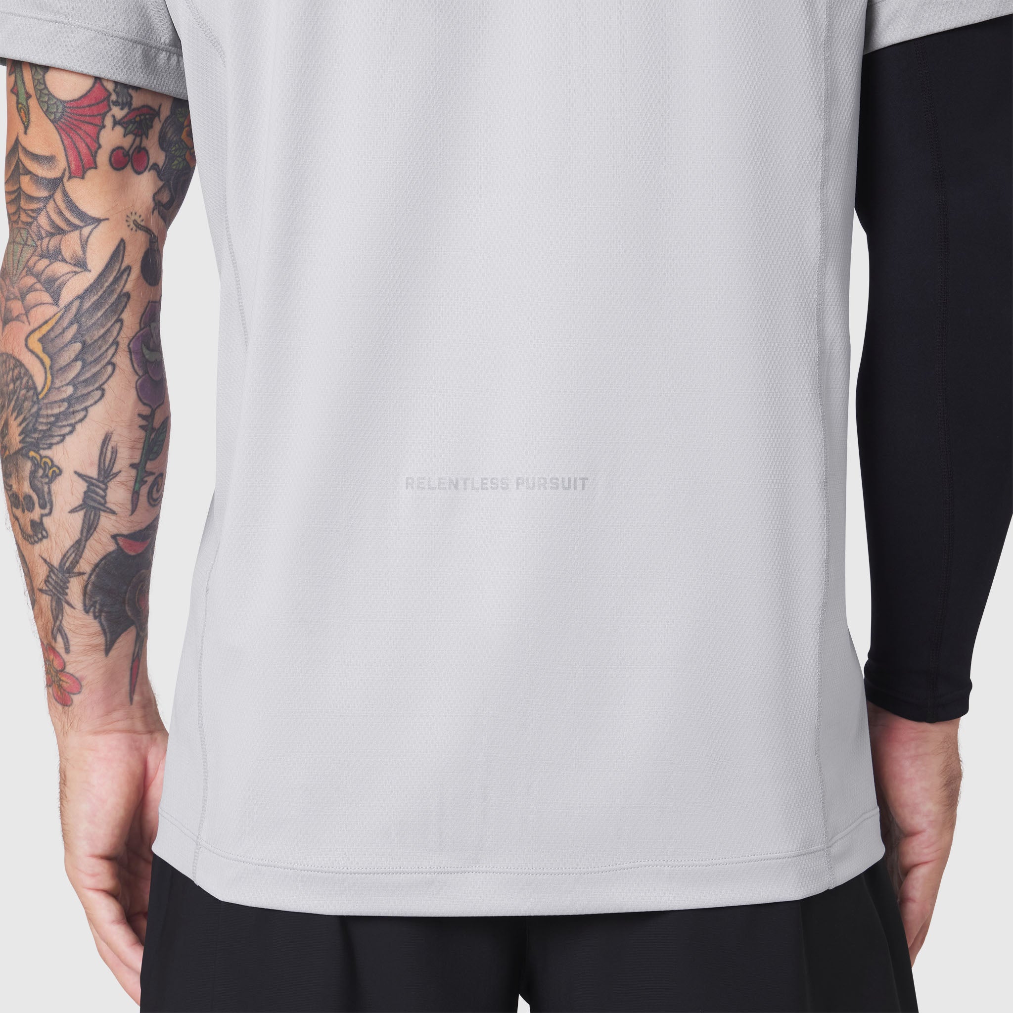 AEROSILVER® UPF50+ Run Tee in white, worn by model showing front and side view