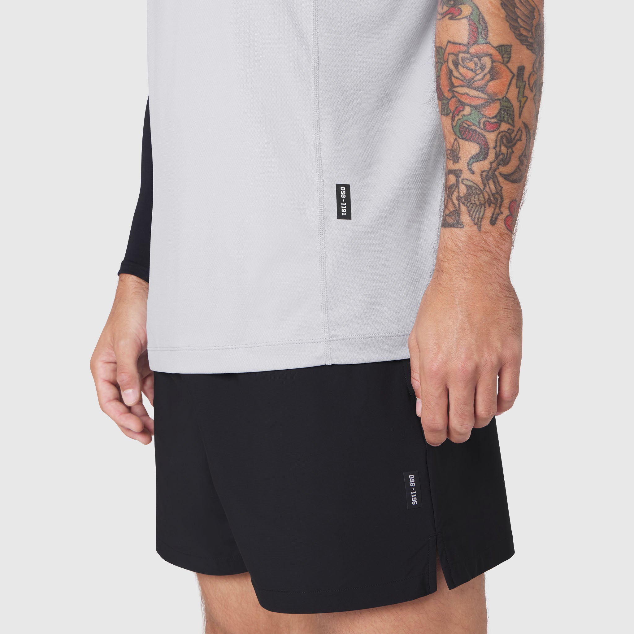AEROSILVER® UPF50+ Run Tee in white worn with black shorts, cropped torso view