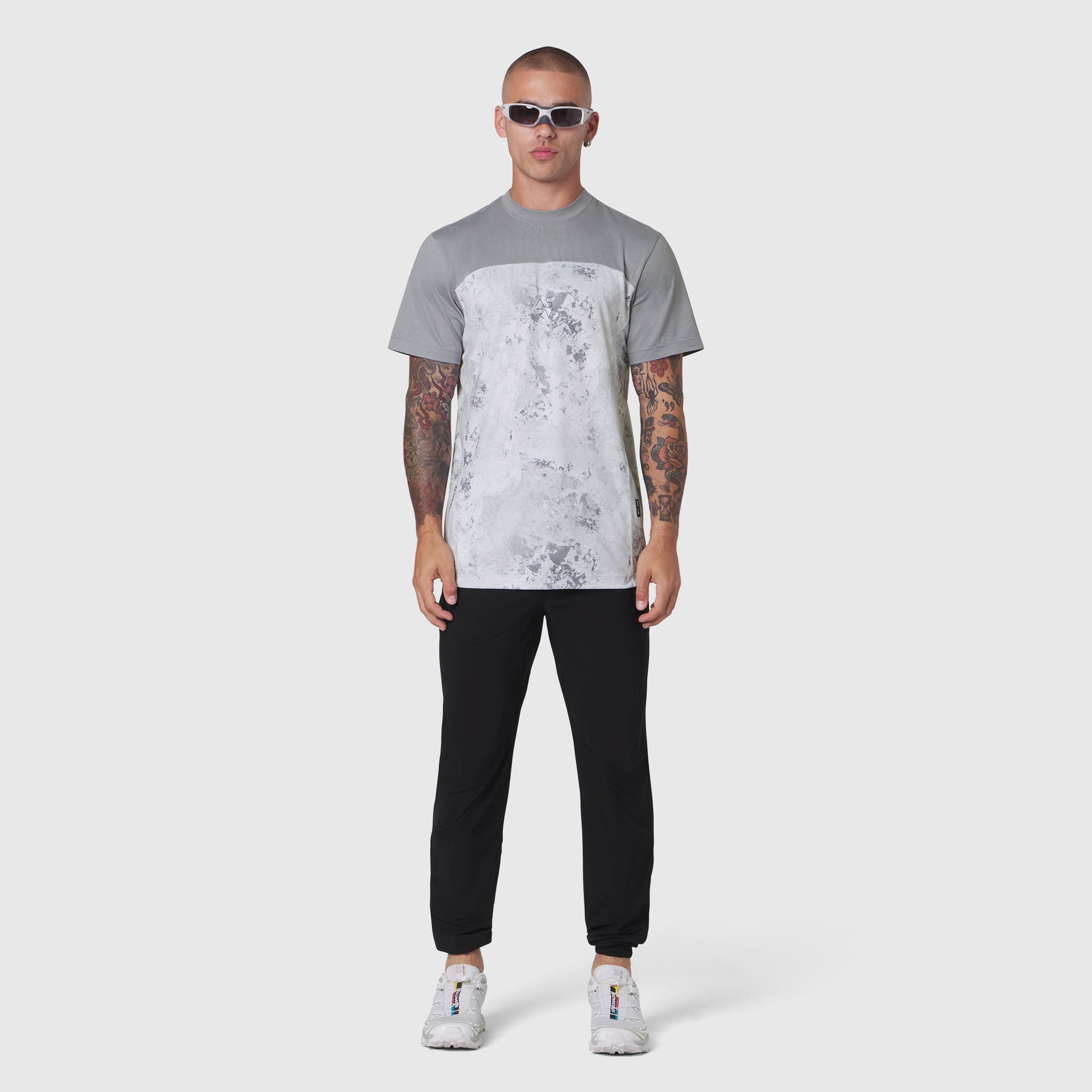 AEROSILVER® UPF50+ Run Tee in Sedona Snow Camo worn by model with black joggers