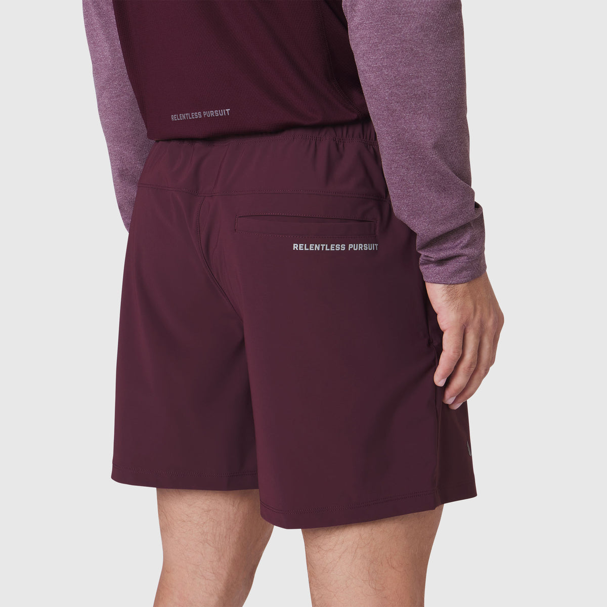 Revolutional Training Short in merlot, back view on model wearing matching long-sleeve top