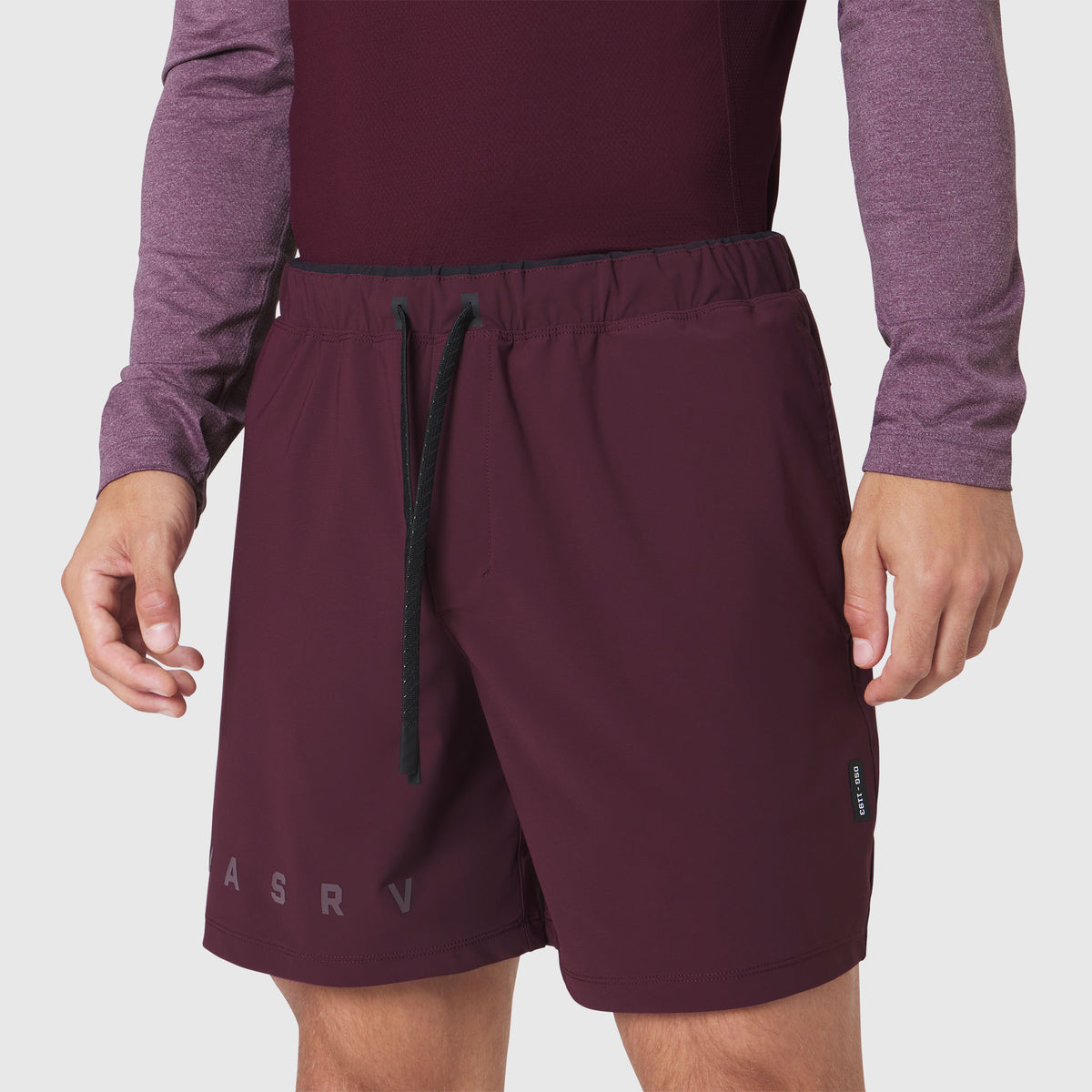 Revolutional Training Short in merlot worn by model, front view
