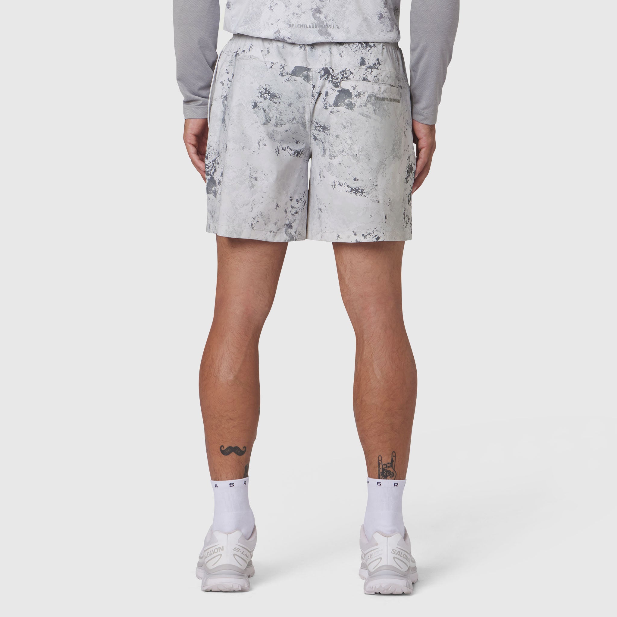 Revolutional Training Short in Sedona Snow Camo worn by model, back view