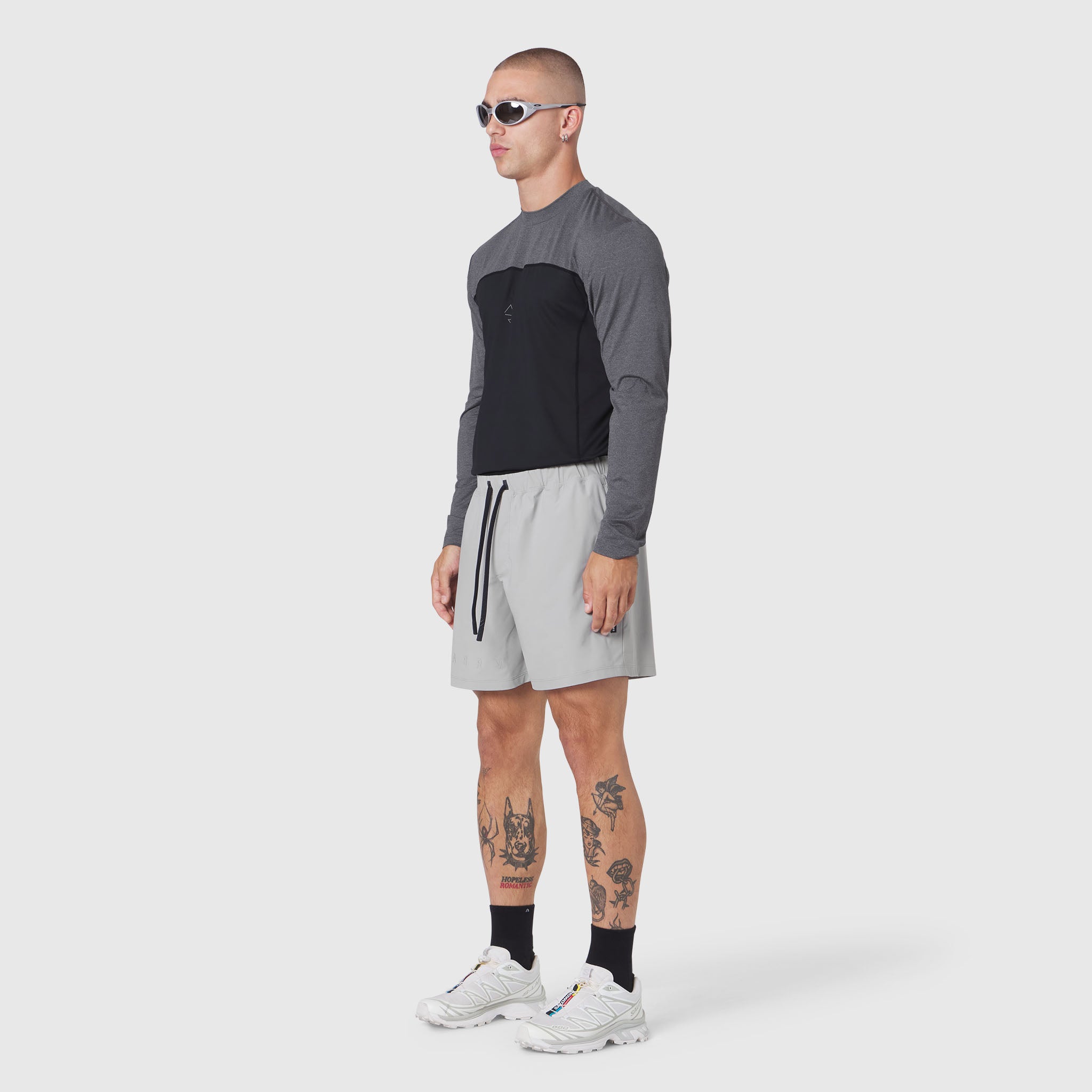 Revolutional Training Short in Slate Grey worn with colorblock long-sleeve top, side view