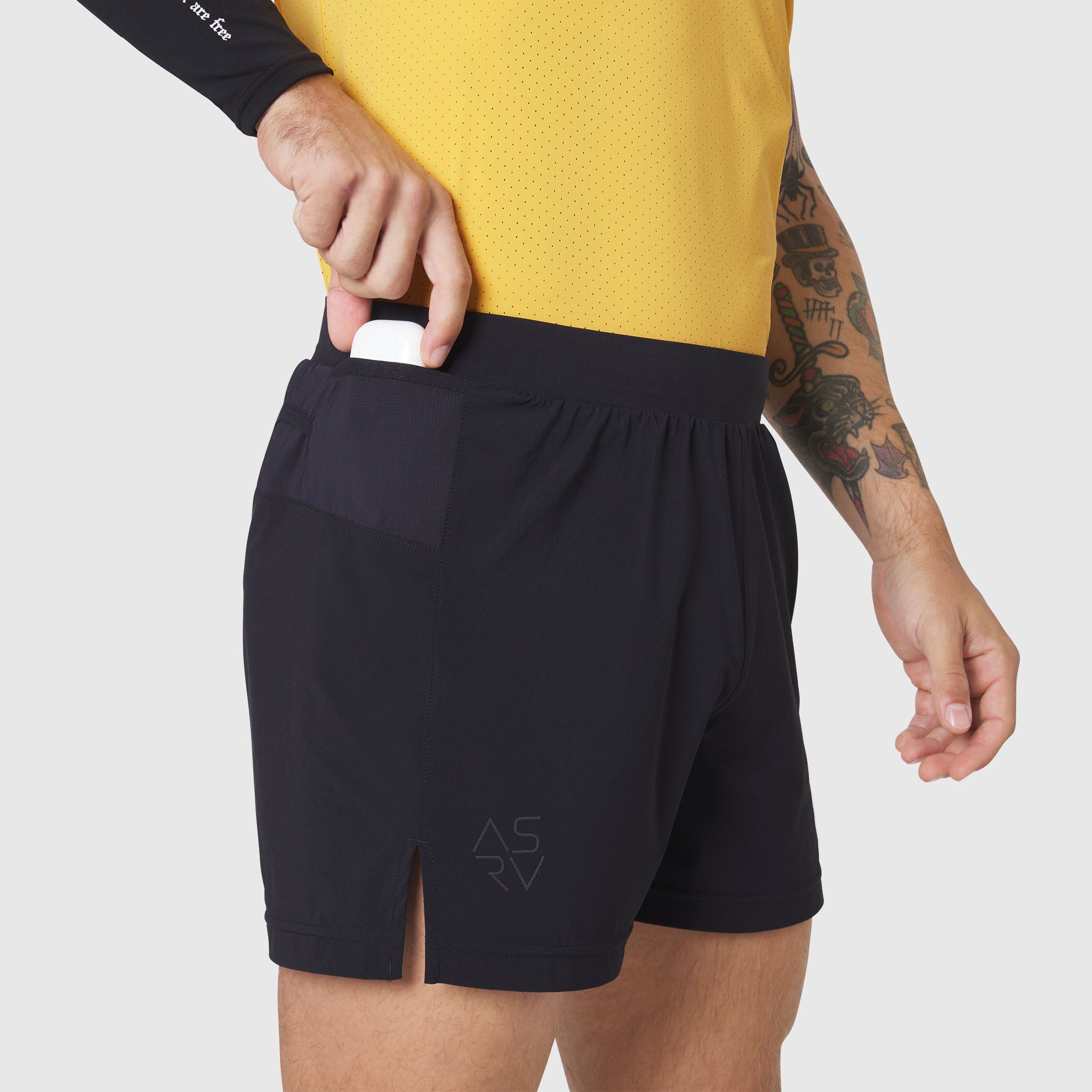 Aerotex™ Distance Run Short in black, worn by model showing side pocket detail and fit
