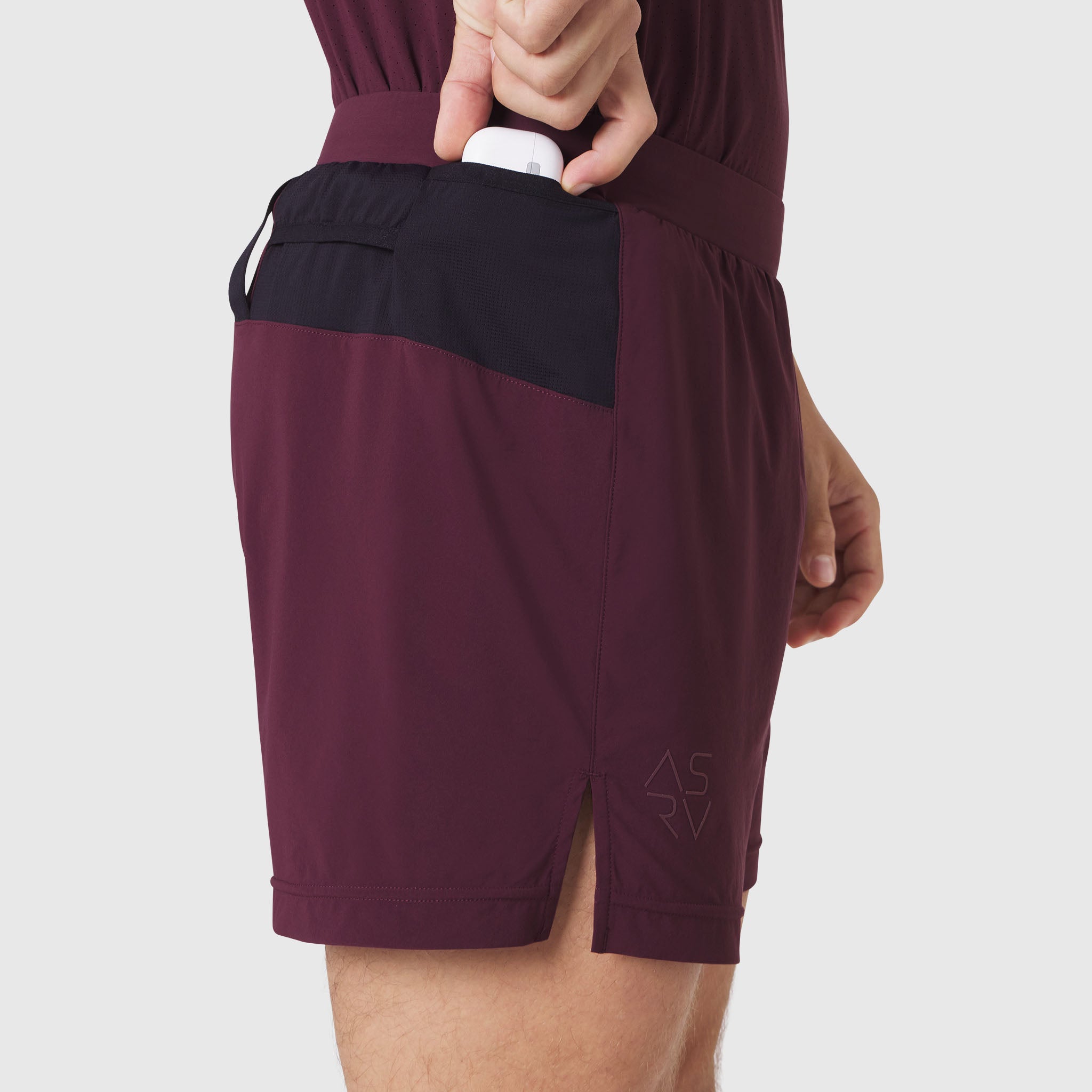 Aerotex Distance Run Short in merlot, model wearing shorts with back pocket detail
