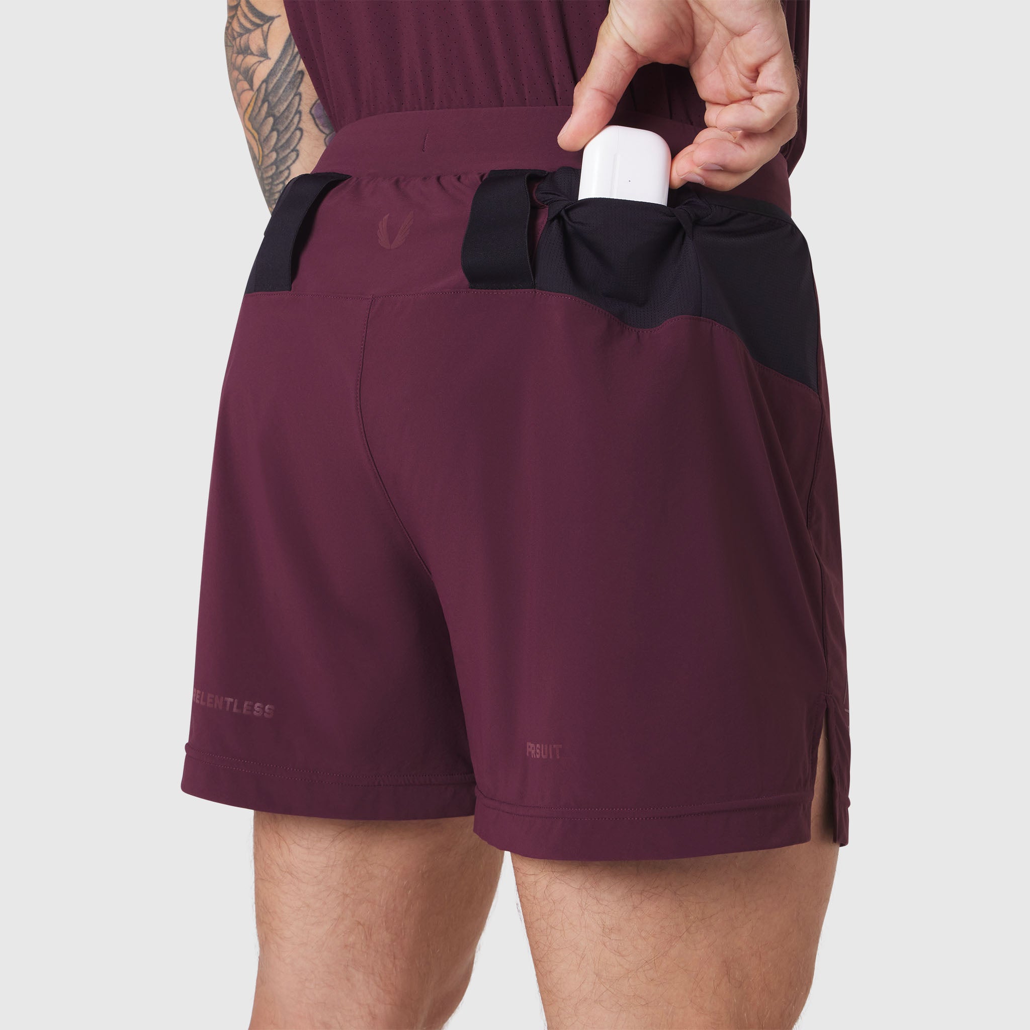 Aerotex Distance Run Short in merlot, worn by model showing back pocket detail