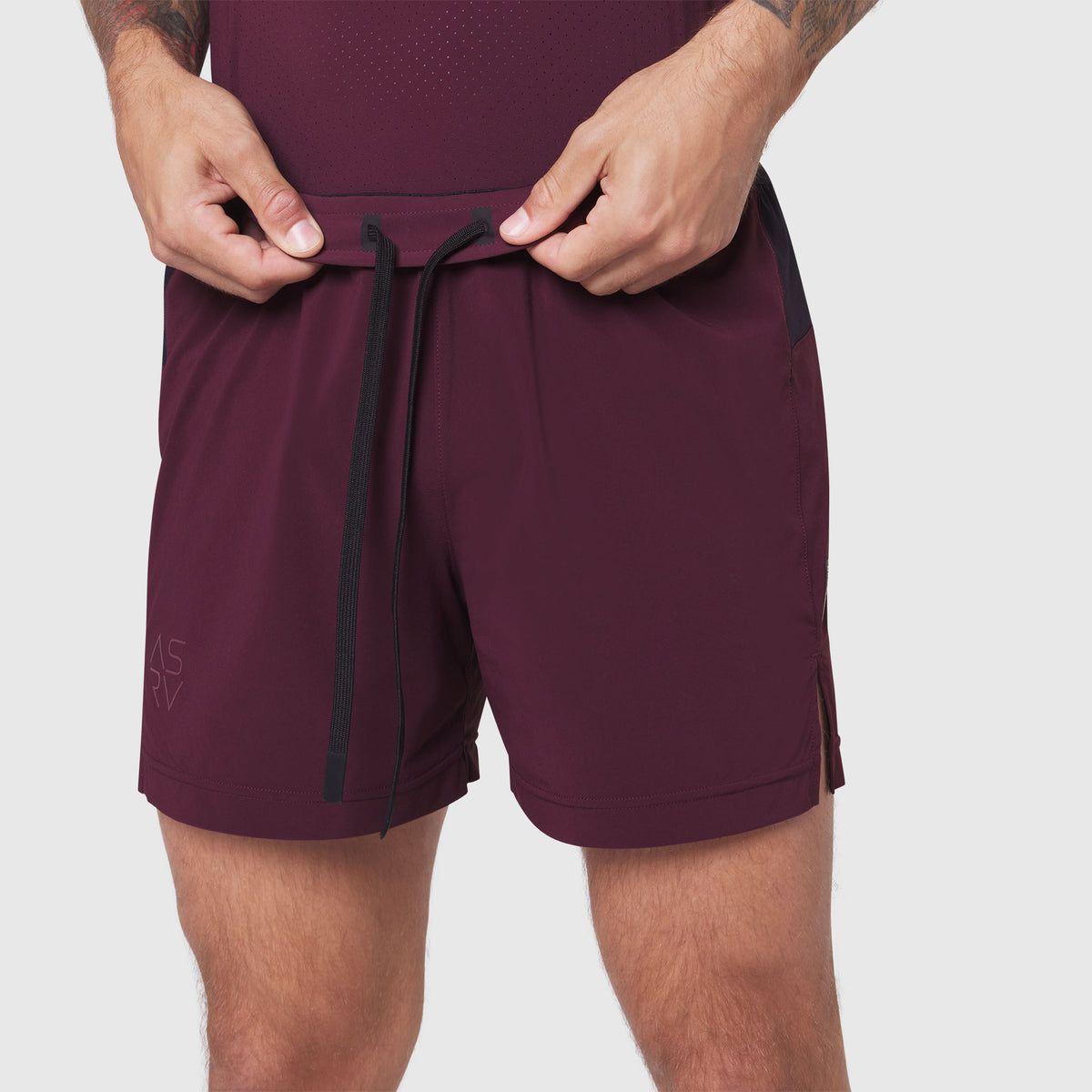 Aerotex Distance Run Short in merlot, model adjusting drawstring at waist