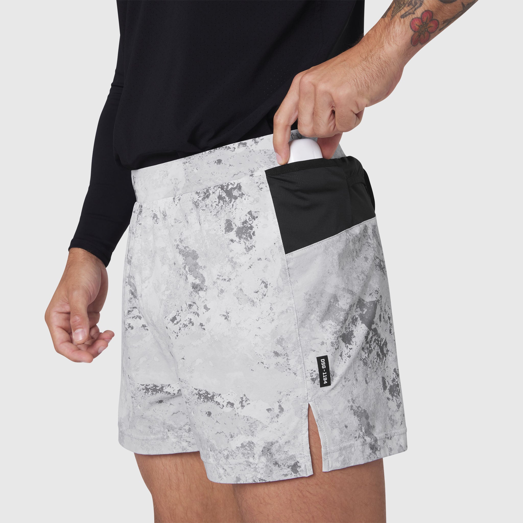 Aerotex Distance Run Short in Sedona Snow Camo worn by model, side view