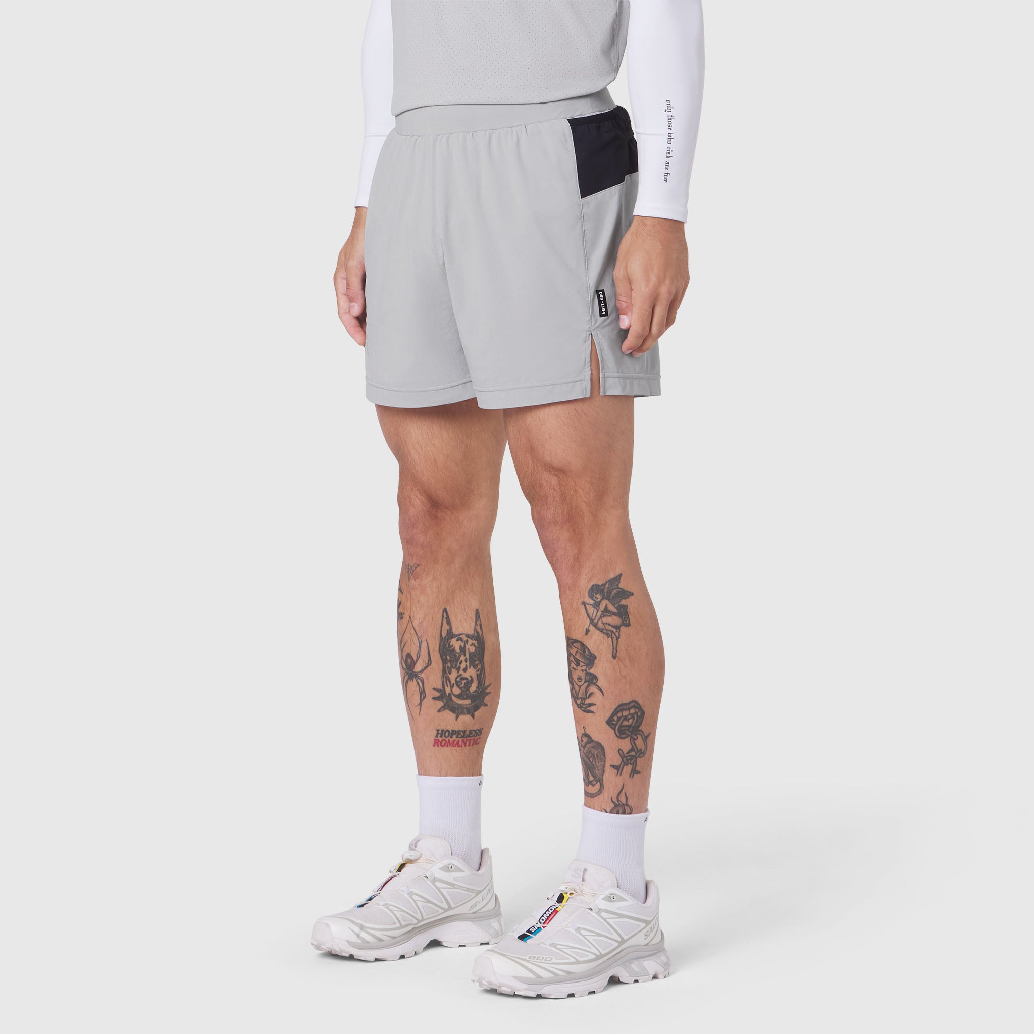 Aerotex™ Distance Run Short in slate grey, modeled on male runner with white long sleeve shirt and white sneakers