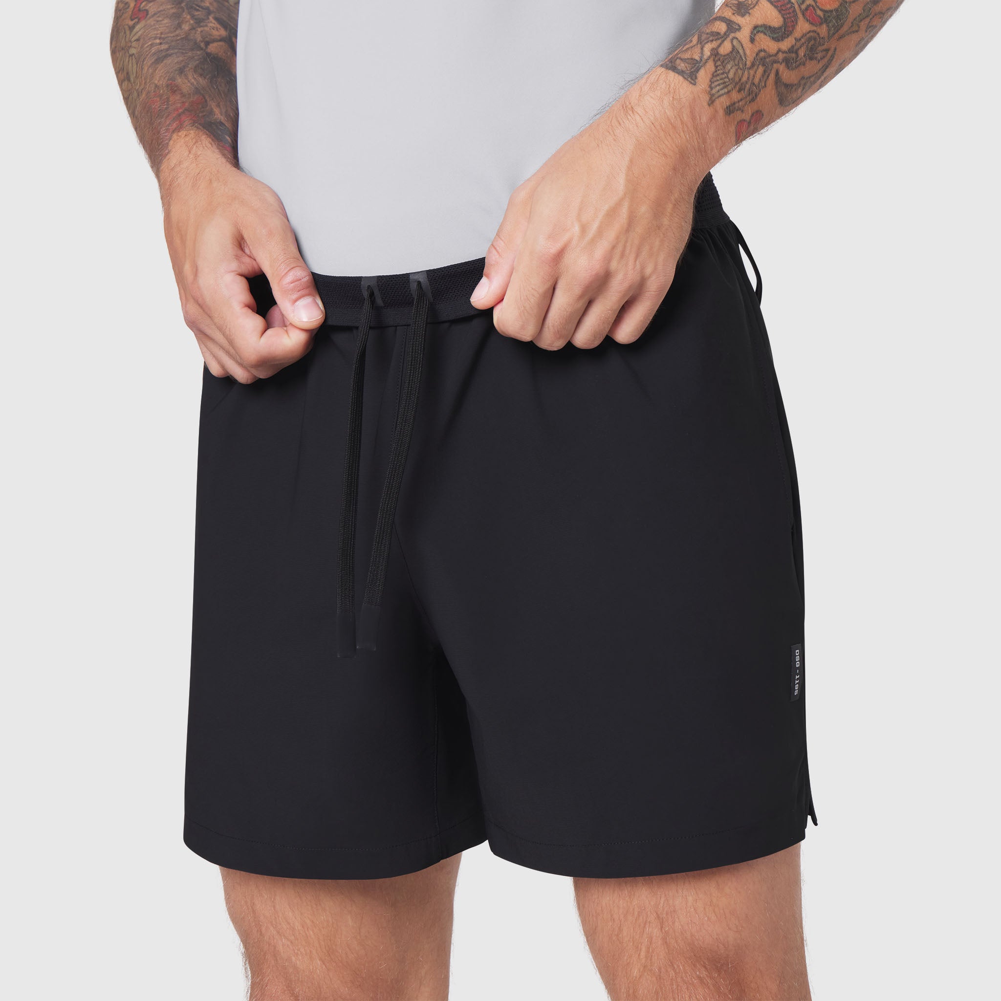 TETRA-LITE® 5" Linerless Training Short in black, worn by model, front view