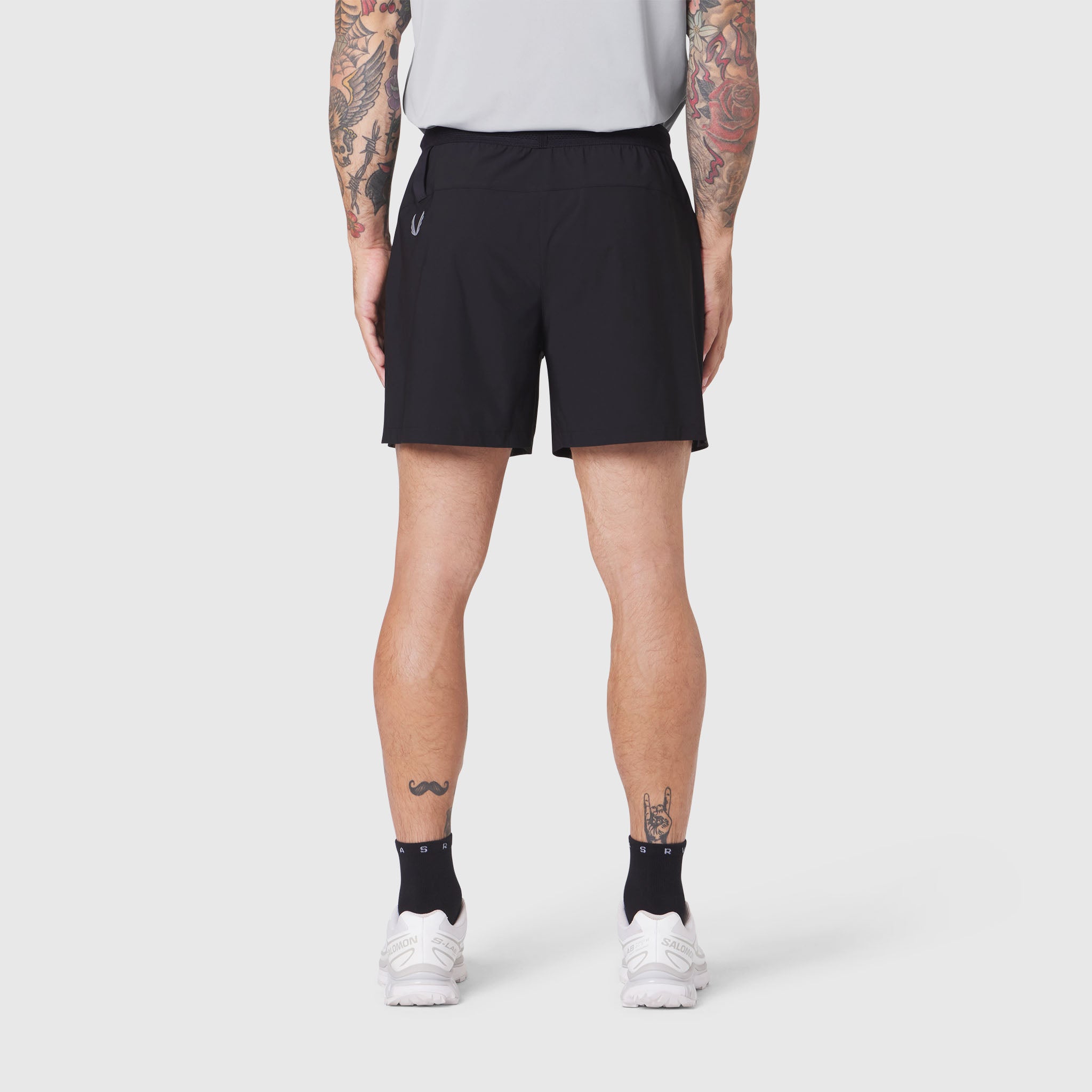 Black TETRA-LITE® 5" linerless training shorts on model, back view