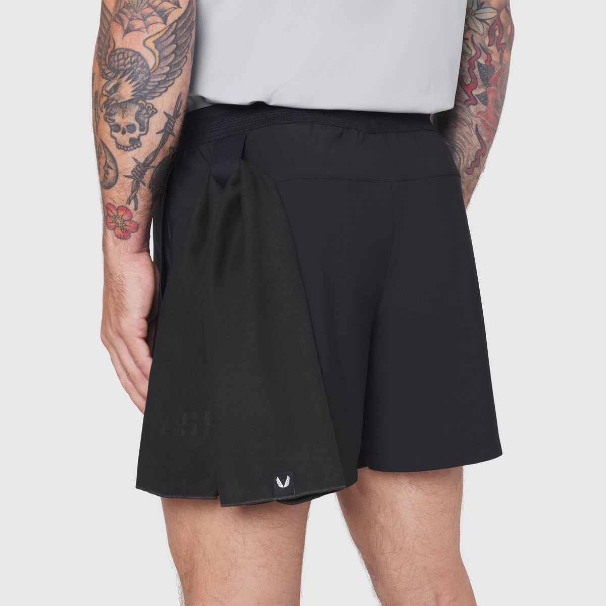 TETRA-LITE® 5" Linerless Training Short in black, worn by model, back view