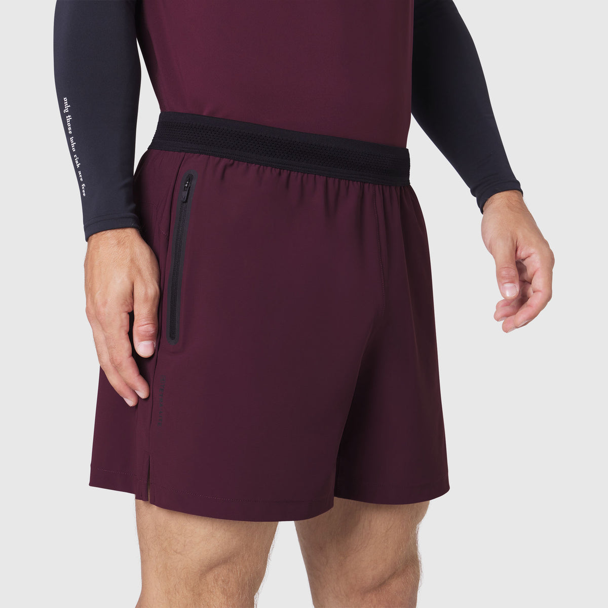 TETRA-LITE® 5" Linerless Training Short in Merlot, worn by model showing side pocket detail