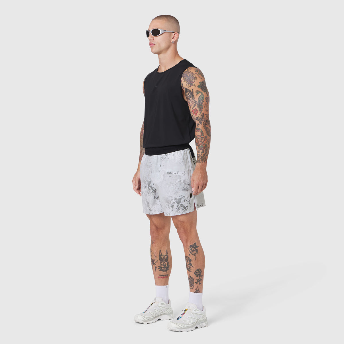 Tetra-Lite 5" Linerless Training Short in Sedona Snow Camo, worn with black sleeveless top