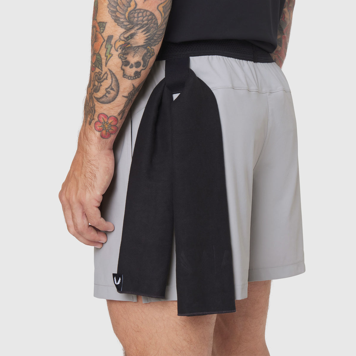 TETRA-LITE® 5" Linerless Training Short in slate grey and black, worn by model showing side view