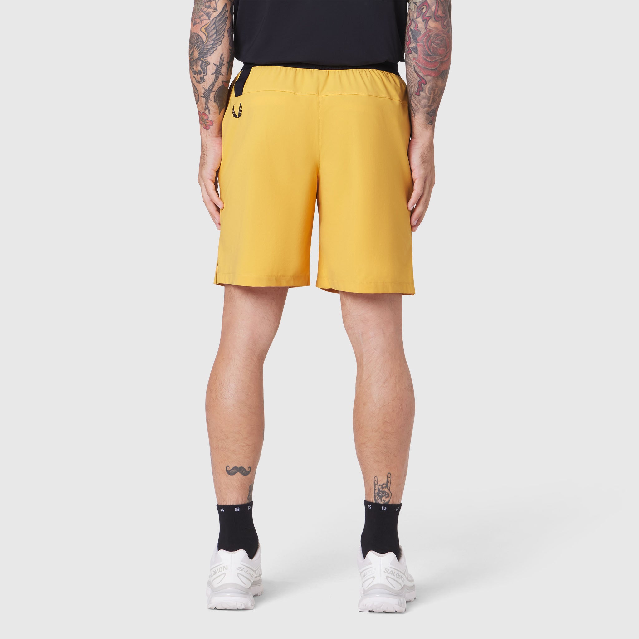 TETRA-LITE® 7" Linerless Training Short in amber, worn from behind