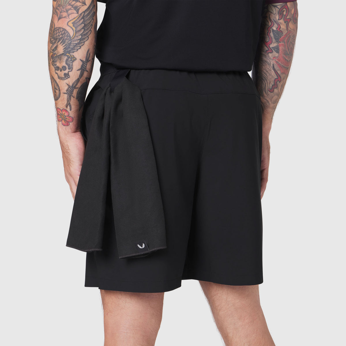 TETRA-LITE® 7" Linerless Training Short in black, rear view on model