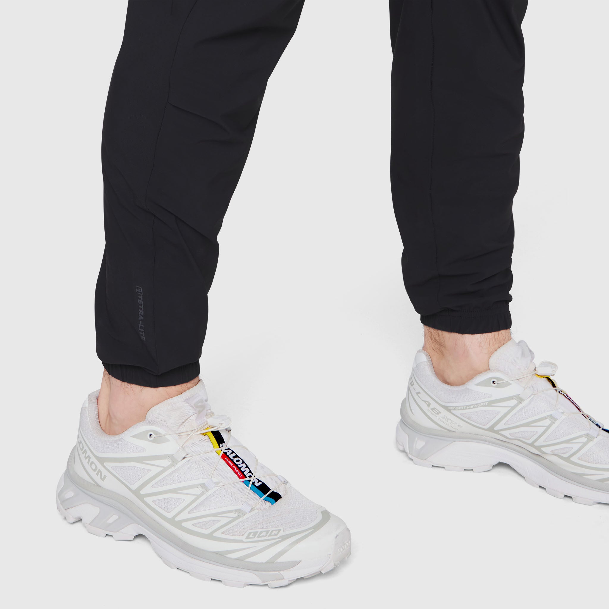Black TETRA-LITE® Training Jogger worn with white sneakers, cropped leg view