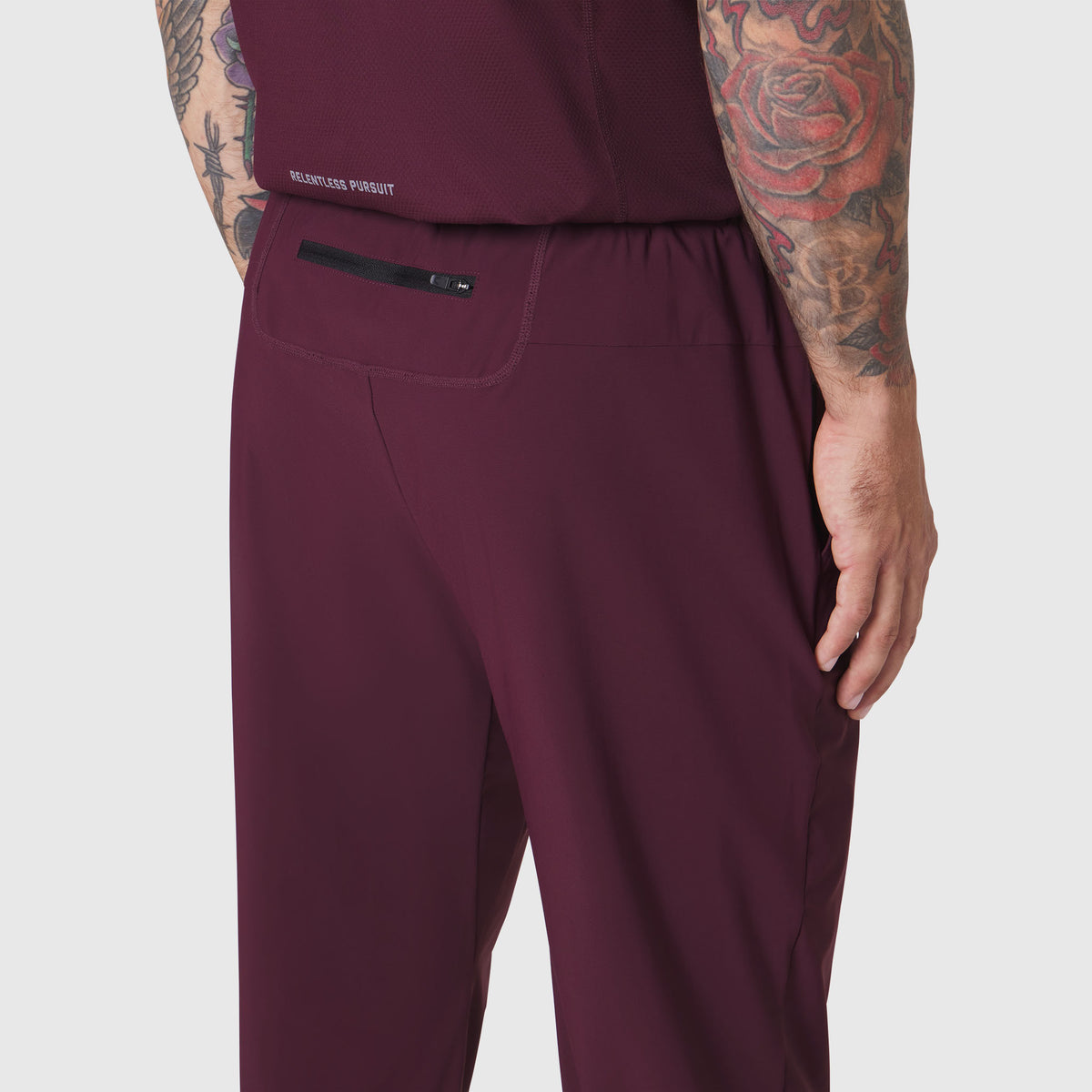 TETRA-LITE Training Jogger in merlot worn by model, side view