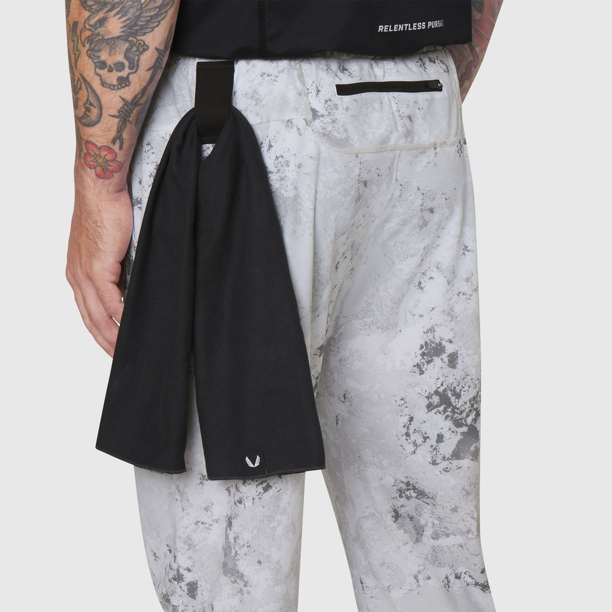 TETRA-LITE Training Jogger in Sedona Snow Camo worn by model, back view with black towel