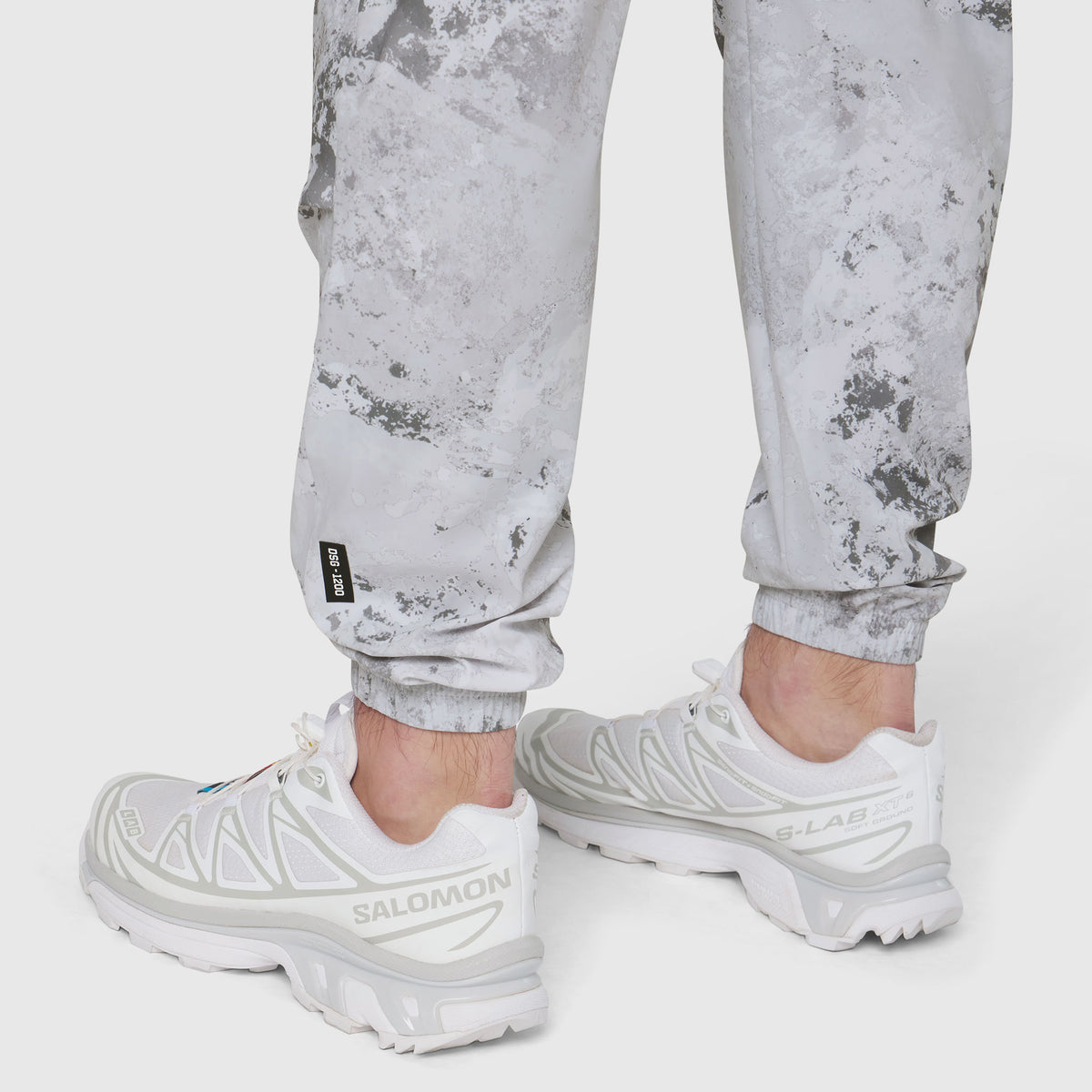 TETRA-LITE Training Jogger in Sedona Snow Camo worn with white sneakers, full length view