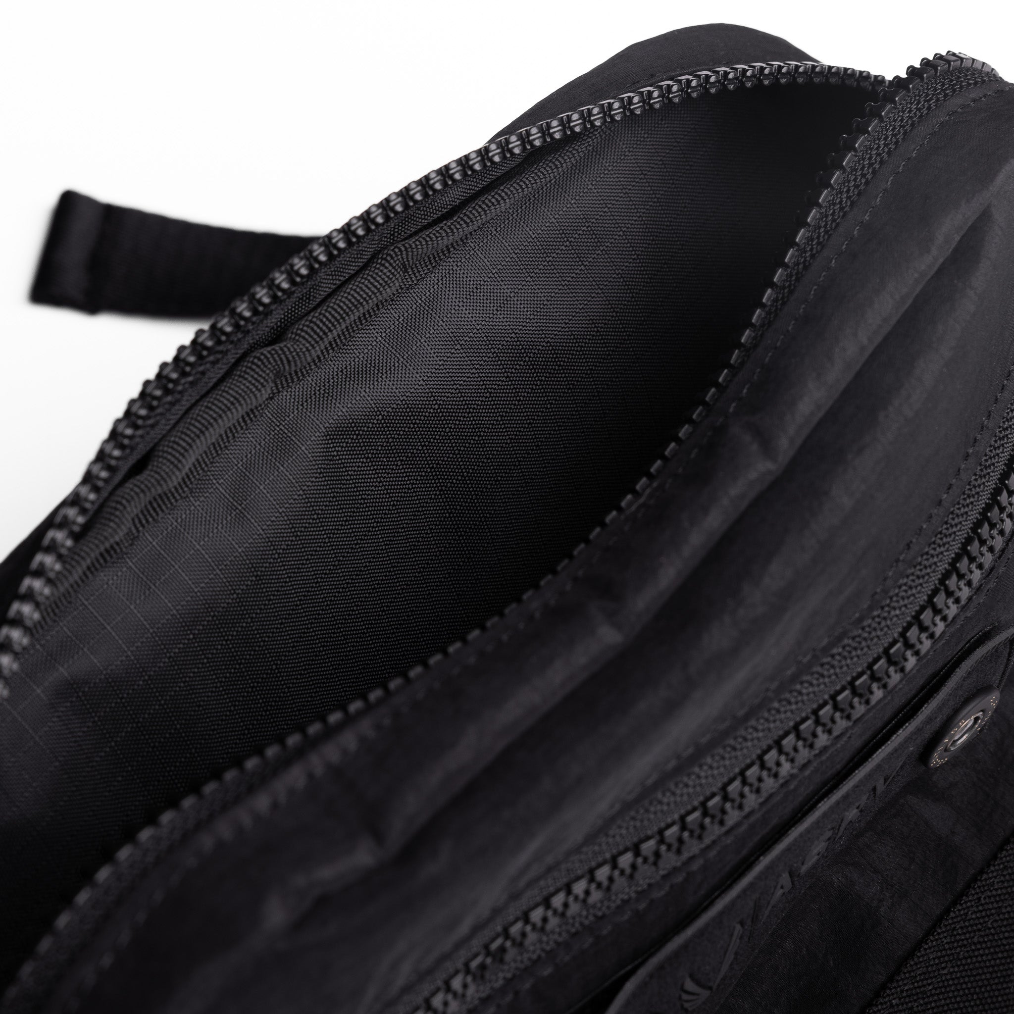 Flatlay 1231 Ripstop Crossbody Bag in black, open interior detail view