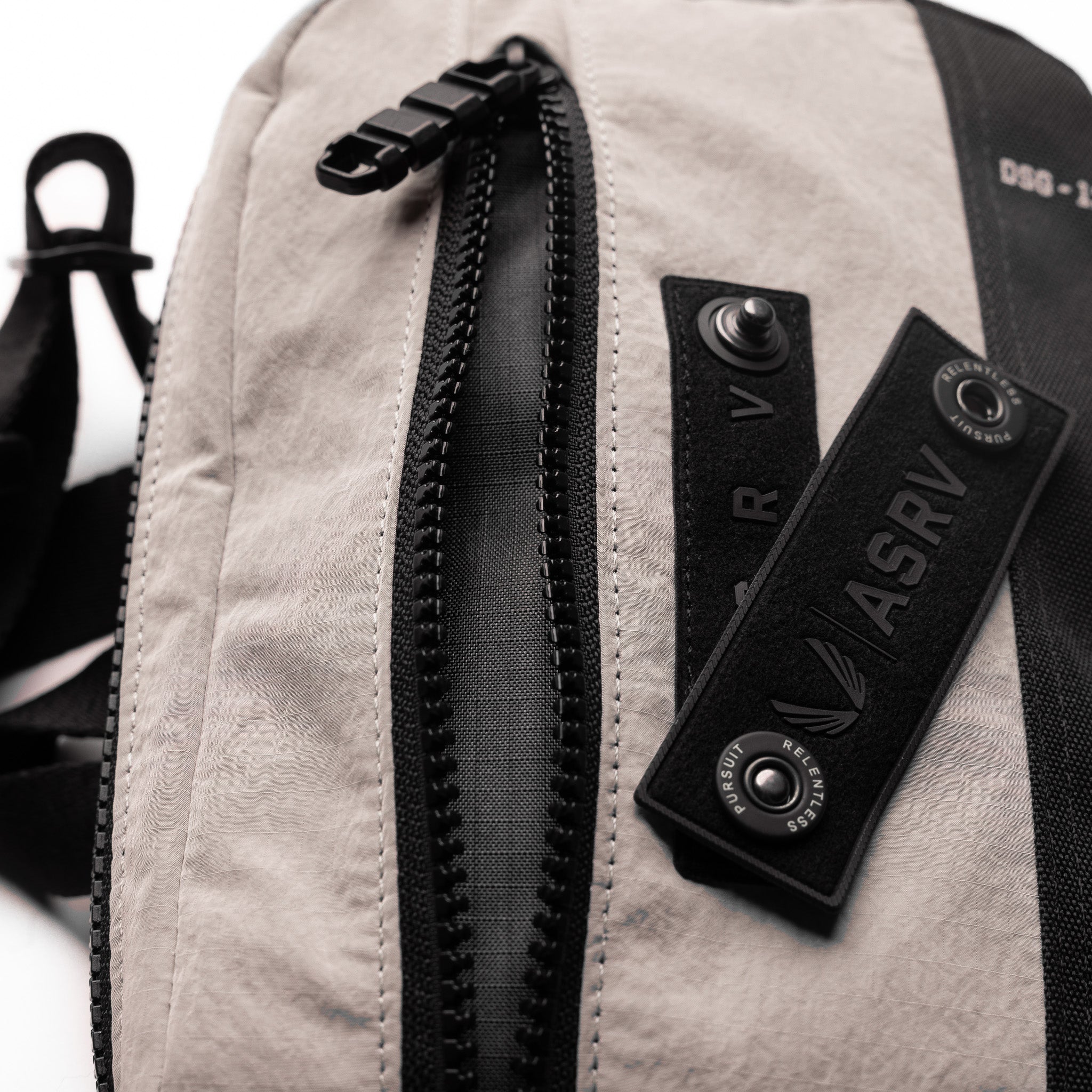 1231. Ripstop Crossbody Bag in Chai, worn across shoulder with detail view